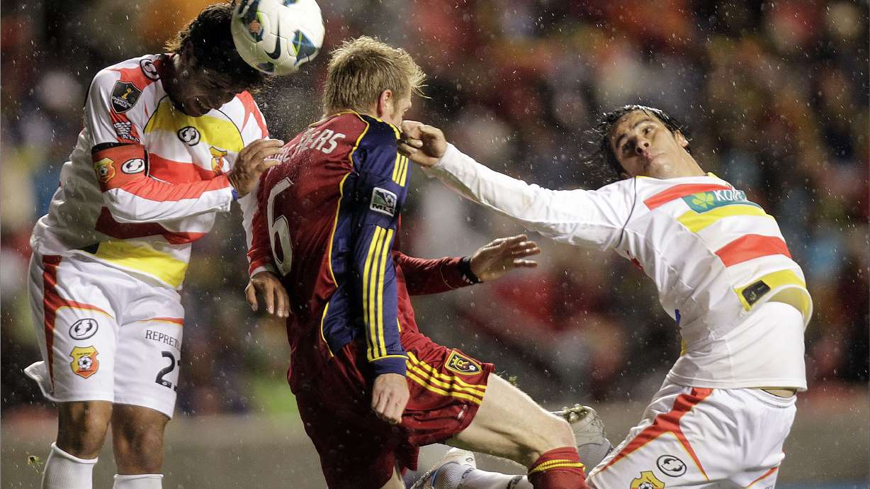 Nat Borchers, center of Real Salt Lake looks to score under the pressure of Pablo Salazar and Cristian Montero of C.S. Herediano during their CONCACAF match up at Rio Tinto Stadium in Sandy, Ut.,Tuesday, Oct. 23, 2012.
