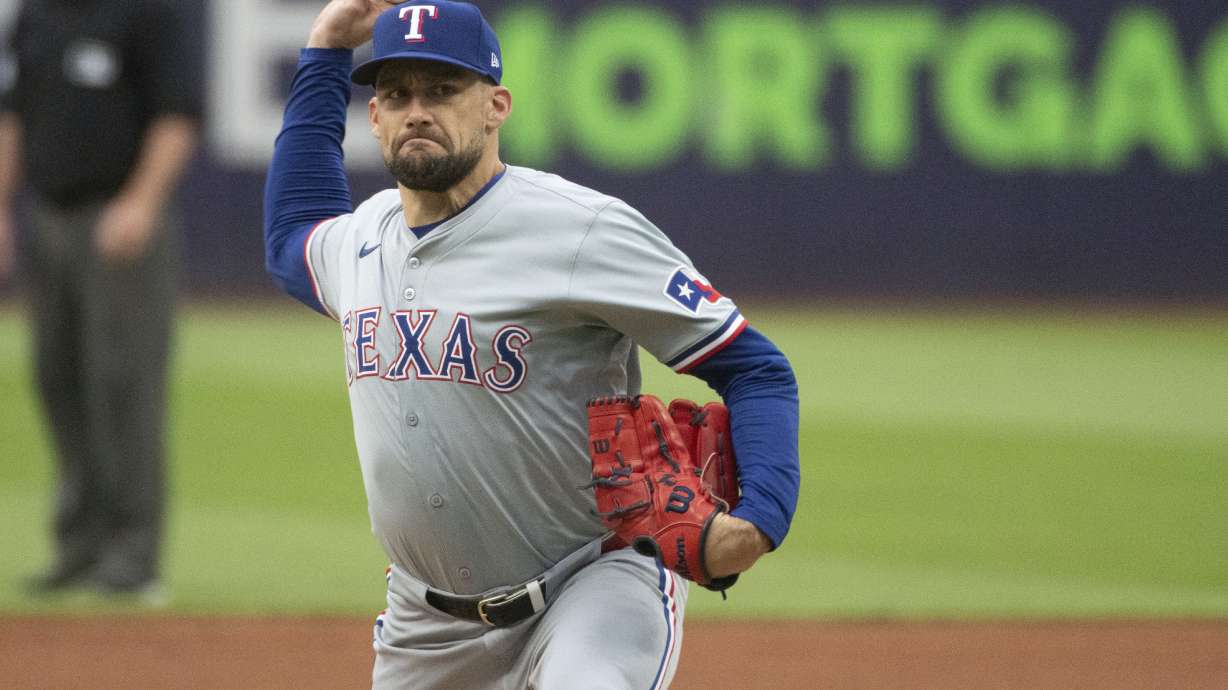 FILE - Texas Rangers starting pitcher Nathan Eovaldi delivers against the Cleveland Guardians during the first inning of a baseball game in Cleveland, Friday, Aug. 23, 2024.