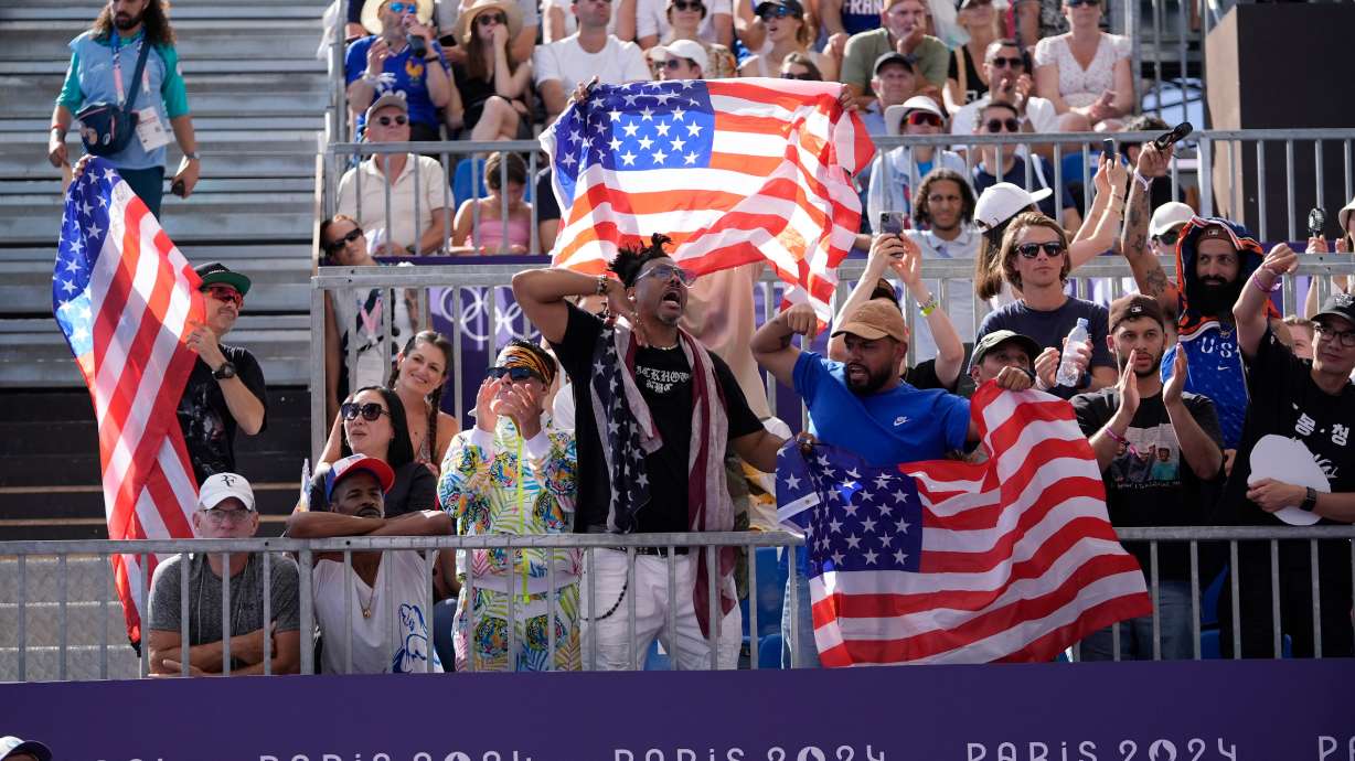 Fans cheer for U.S. athletes during the B-Boys round-robin battle for the breaking competition at La Concorde Urban Park at the 2024 Summer Olympics in Paris. The organizers of the Paris Olympics and Paralympics have announced the equivalent of just over $28 million left after hosting.