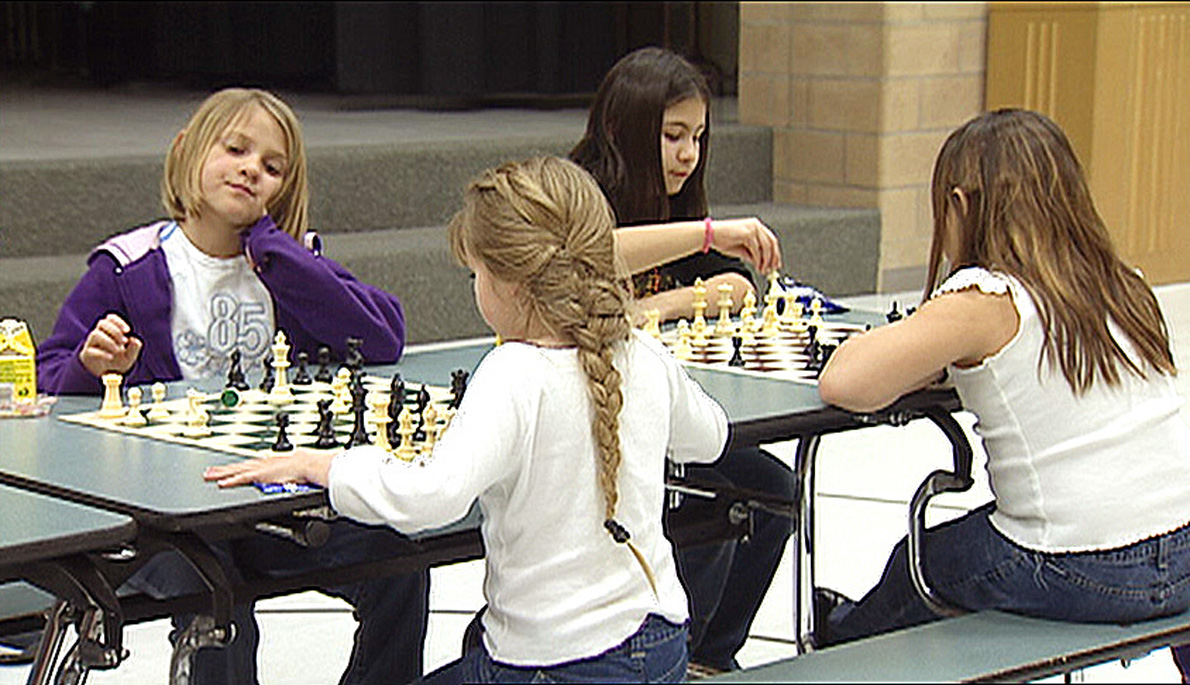 Kids play chess at a No Child Left Behind program in 2004. Although chess is typically dominated by men, the number of girls playing is increasing.