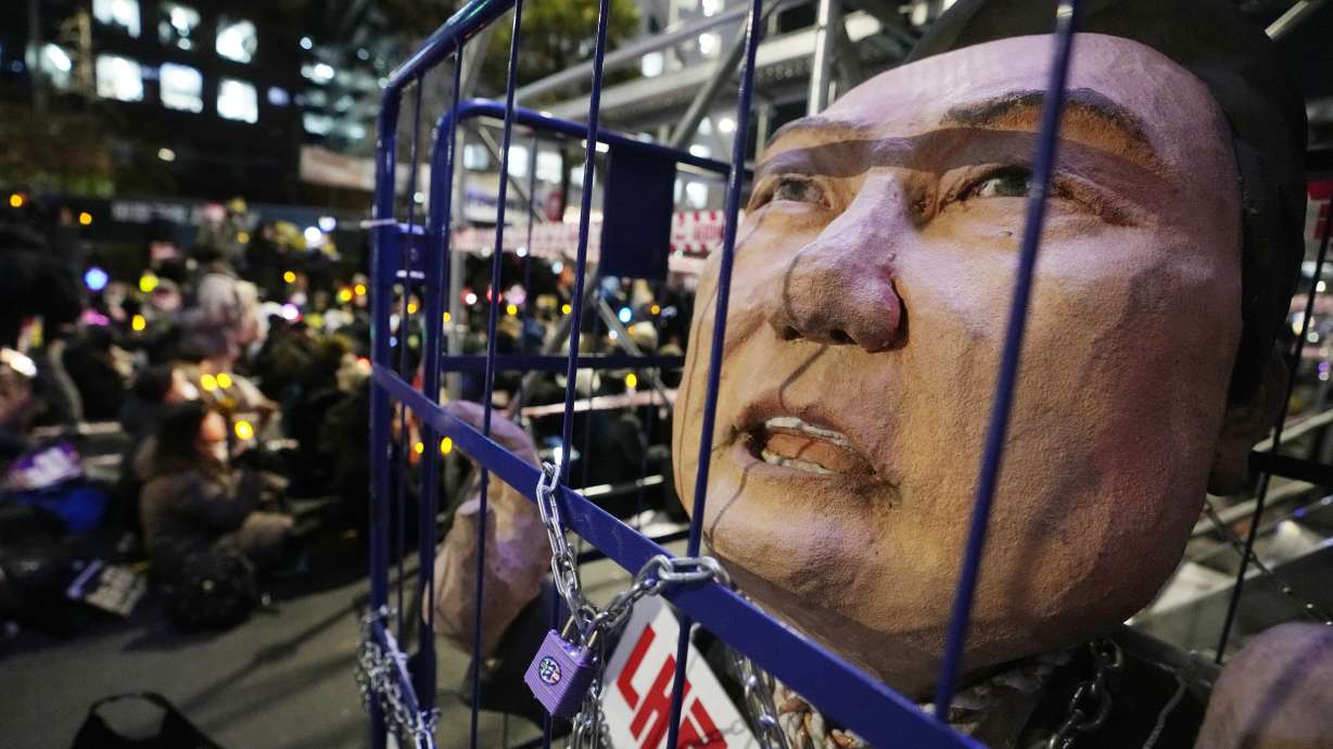 A caricature depicting an imprisoned South Korean President Yoon Suk Yeol is displayed during a rally to demand his impeachment outside the National Assembly in Seoul, South Korea, on Friday.