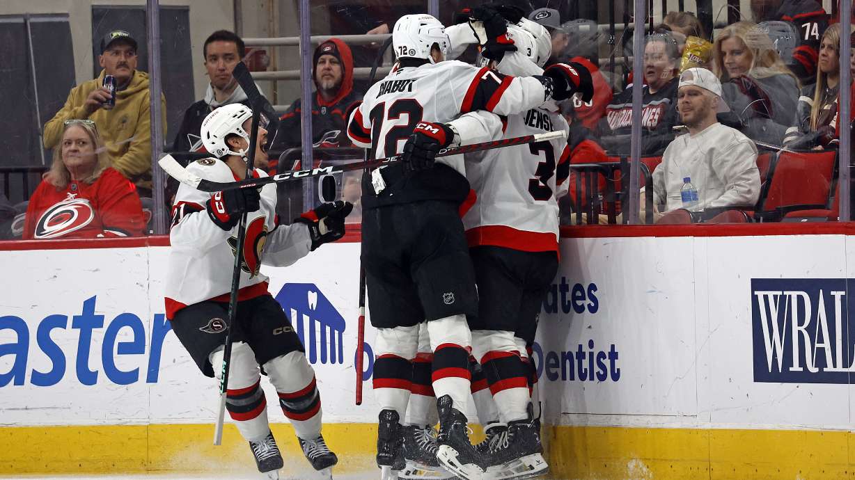 The Ottawa Senators celebrate a goal by Shane Pinto during the second period of an NHL hockey game against the Carolina Hurricanes in Raleigh, N.C., Friday, Dec. 13, 2024.