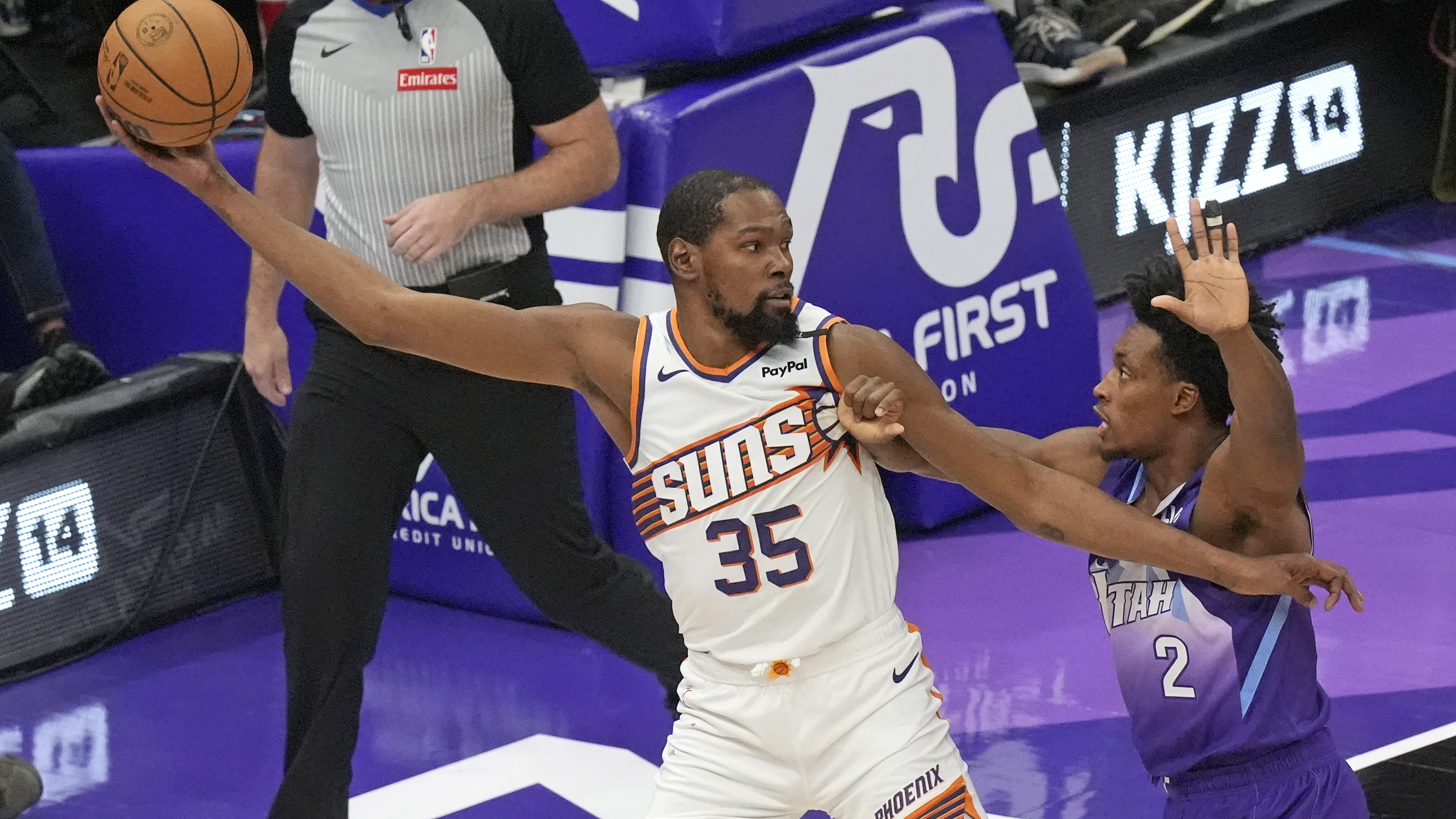 Utah Jazz guard Collin Sexton (2) defends against Phoenix Suns forward Kevin Durant (35) during the first half of an NBA basketball game Friday, Dec. 13, 2024, in Salt Lake City.