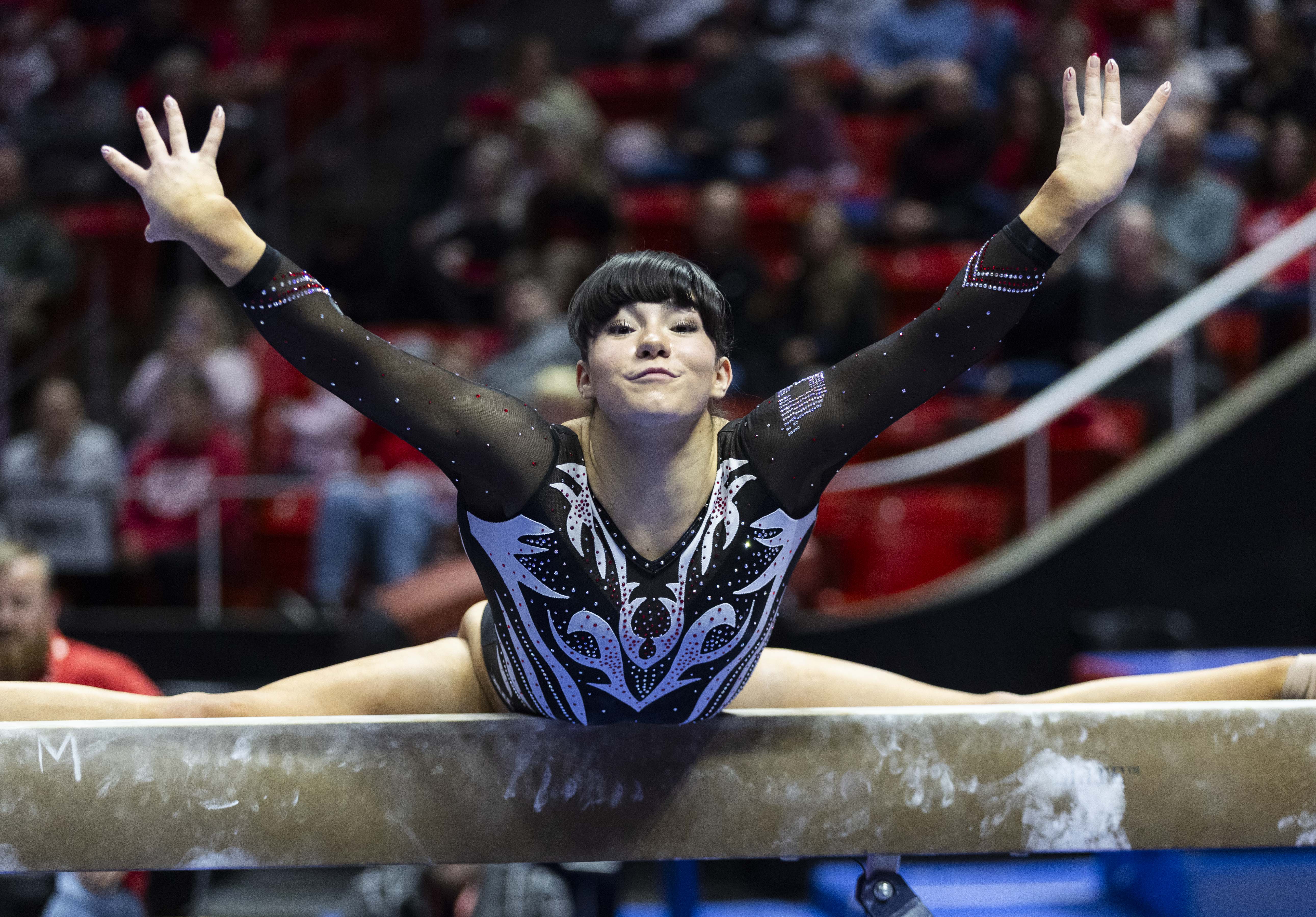 Clara Raposo performs her beam routine during the Red Rocks preview at the Jon M. Huntsman Center on the campus of the University of Utah in Salt Lake City on Friday, Dec. 13, 2024.