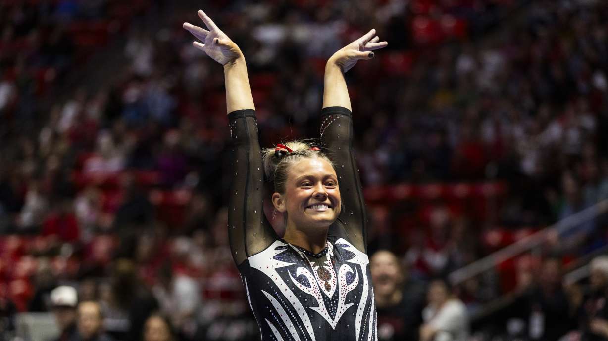 Avery Neff celebrates after performing her vault routine during the Red Rocks preview at the Jon M. Huntsman Center on the campus of the University of Utah in Salt Lake City on Friday, Dec. 13, 2024.