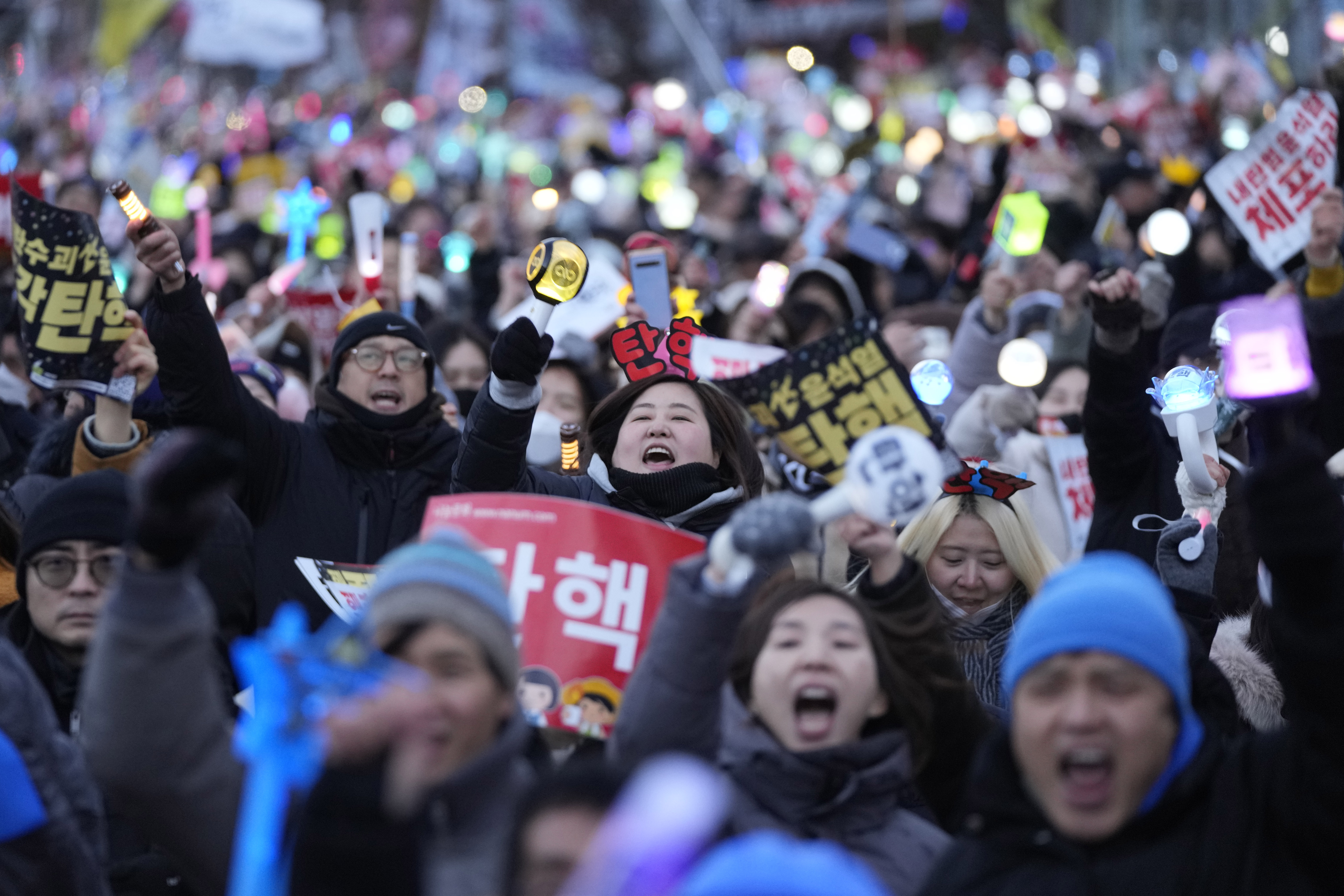 Participants celebrate after hearing the news that South Korea's parliament voted to impeach President Yoon Suk Yeol outside the National Assembly in Seoul, South Korea, on Saturday.