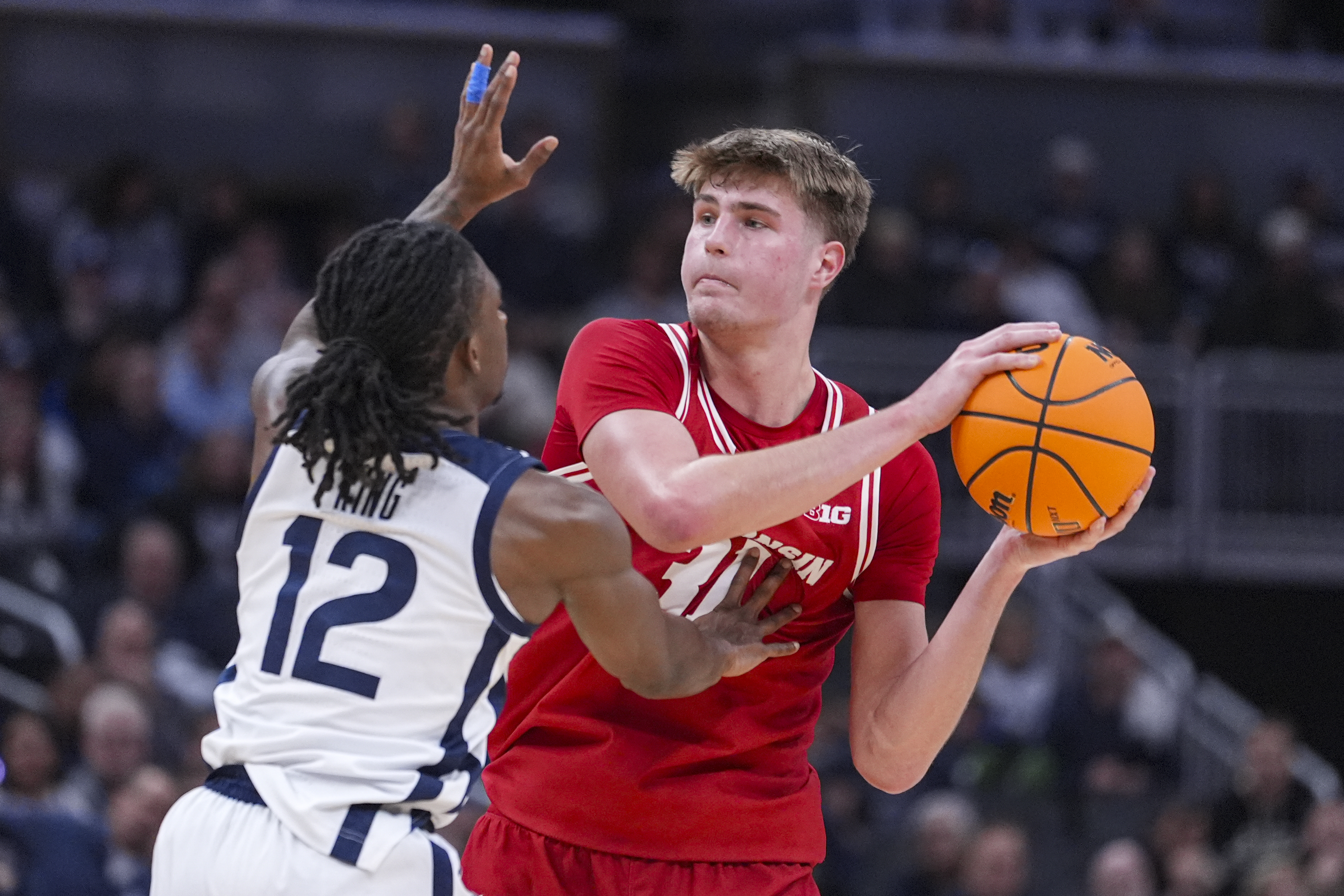 Steven Crowl scores a season-high 20 points to help No. 20 Wisconsin get past Butler 83-74