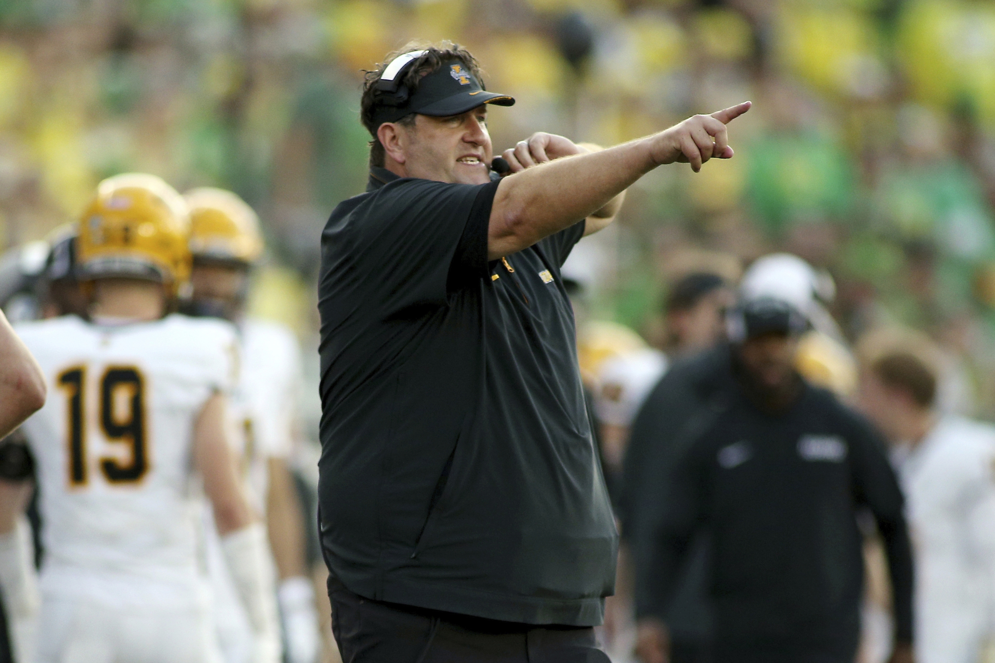 FILE - Idaho head coach Jason Eck calls to his players during the second half of an NCAA college football game against Oregon, Saturday, Aug. 31, 2024, in Eugene, Ore.