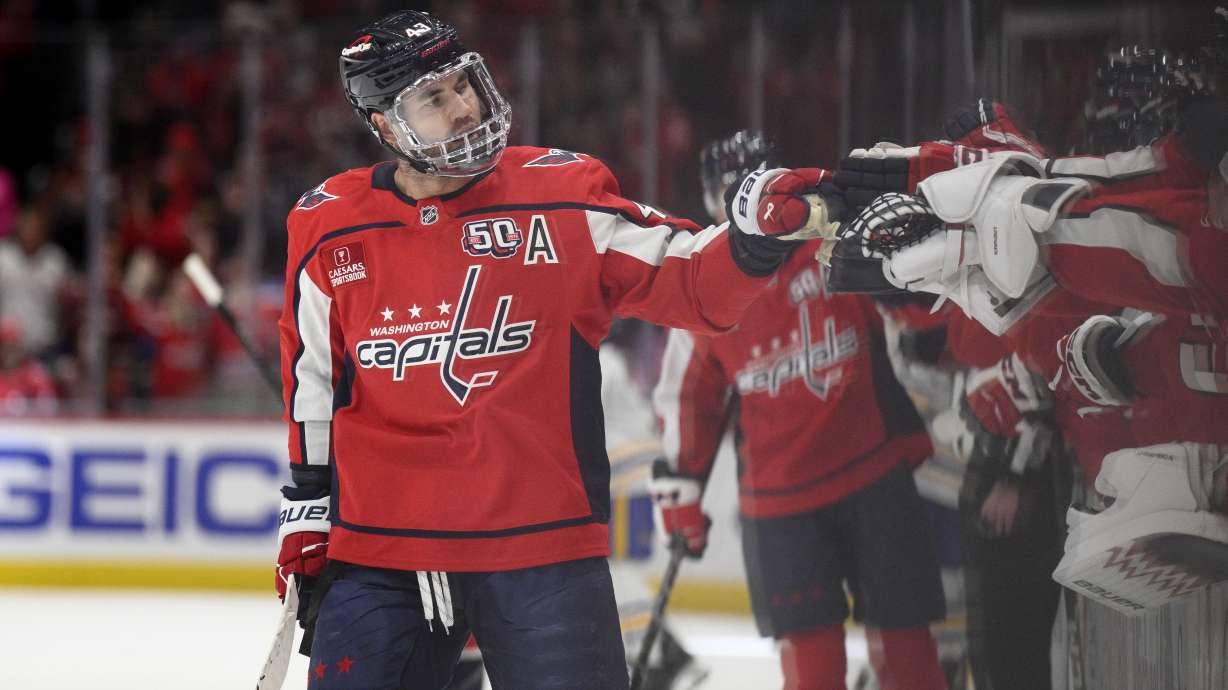 Washington Capitals right wing Tom Wilson (43) celebrates after his goal during the first period of an NHL hockey game against the Buffalo Sabres, Saturday, Dec. 14, 2024, in Washington.