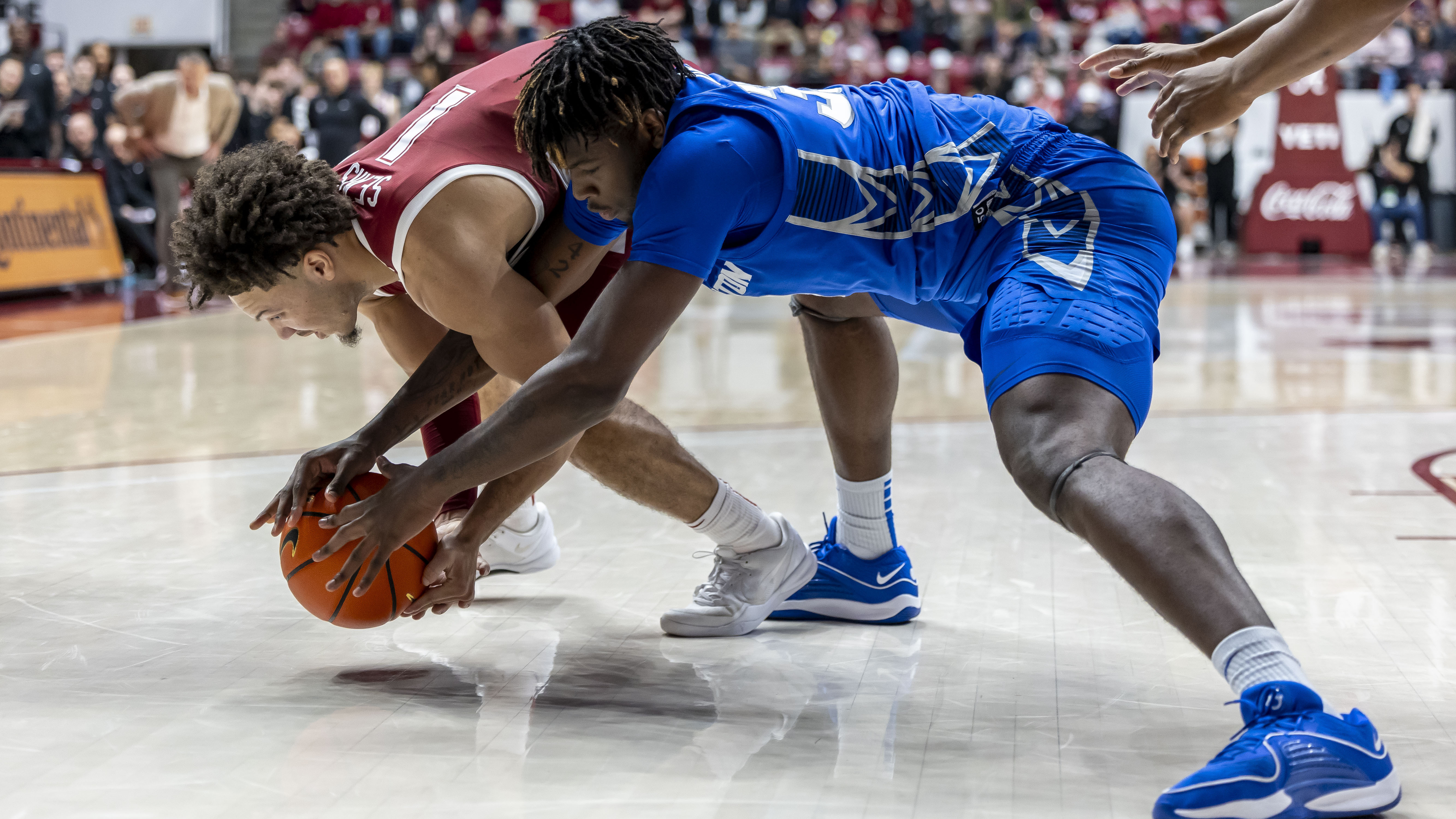 Alabama guard Mark Sears (1) goes for a steal against Creighton center Fredrick King (33) during the second half of an NCAA college basketball game, Saturday, Dec. 14, 2024, in Tuscaloosa, Ala.
