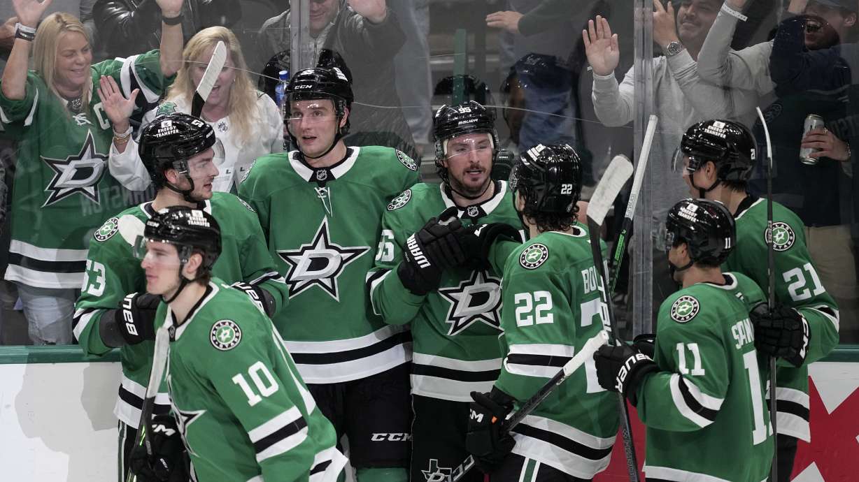 Dallas Stars center Matt Duchene (95) celebrates with Mavrik Bourque (22) and others after scoring in overtime of an NHL hockey game against the St. Louis Blues in Dallas, Saturday, Dec. 14, 2024.