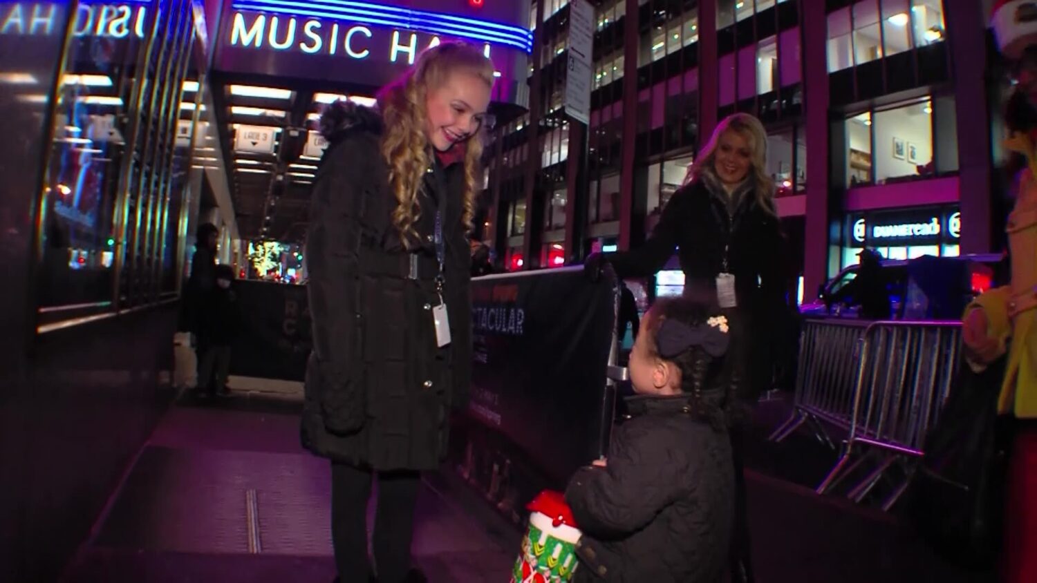 Rylee Rogers, left, speaks to a fan in New York City after the Radio City Christmas Spectacular in 2014.