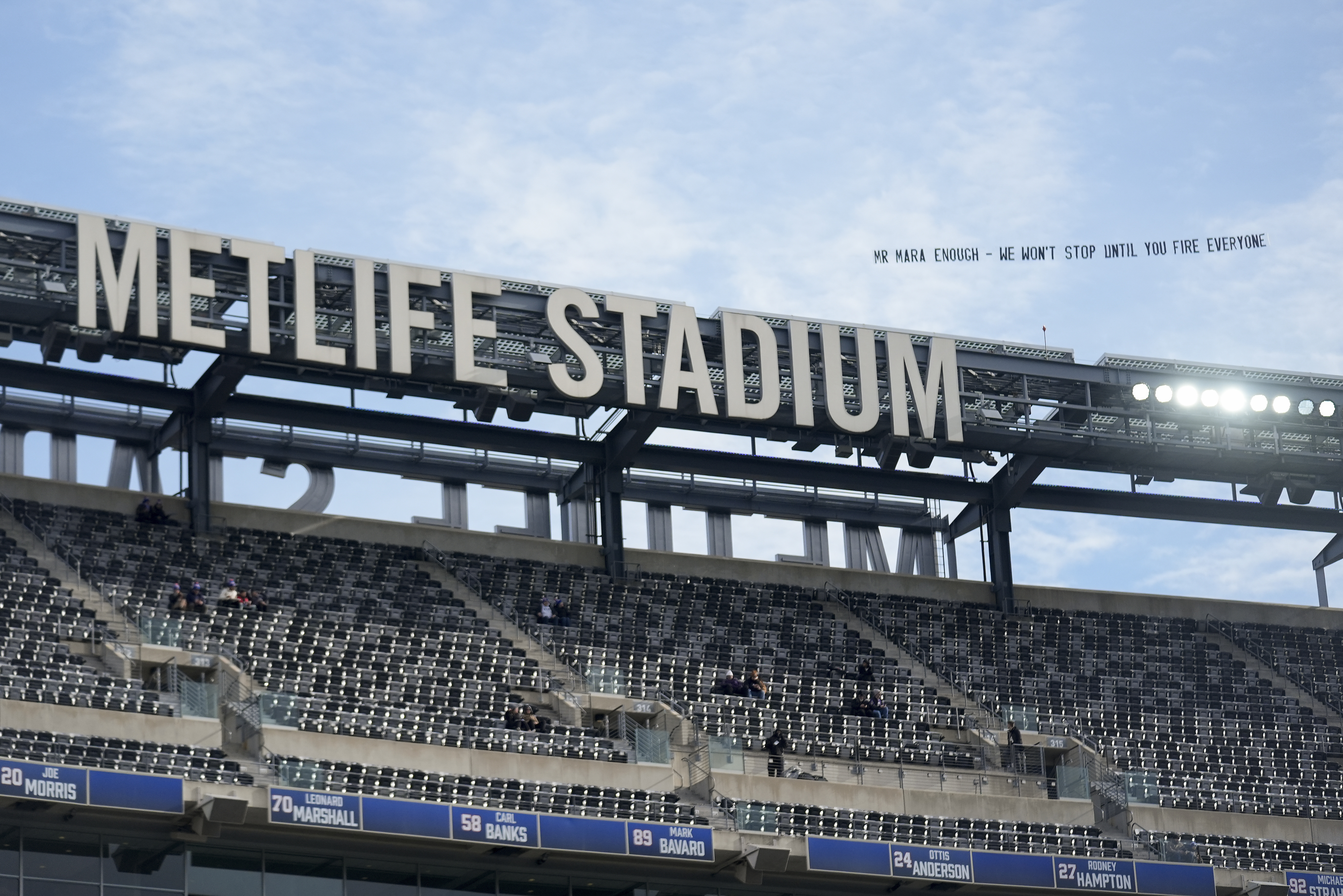 A plan pulls a banner, directed at New York Giants owner John Mara, over Met Life Stadium before an NFL football game between the New York Giants and the Baltimore Ravens, Sunday, Dec. 15, 2024, in East Rutherford, N.J.