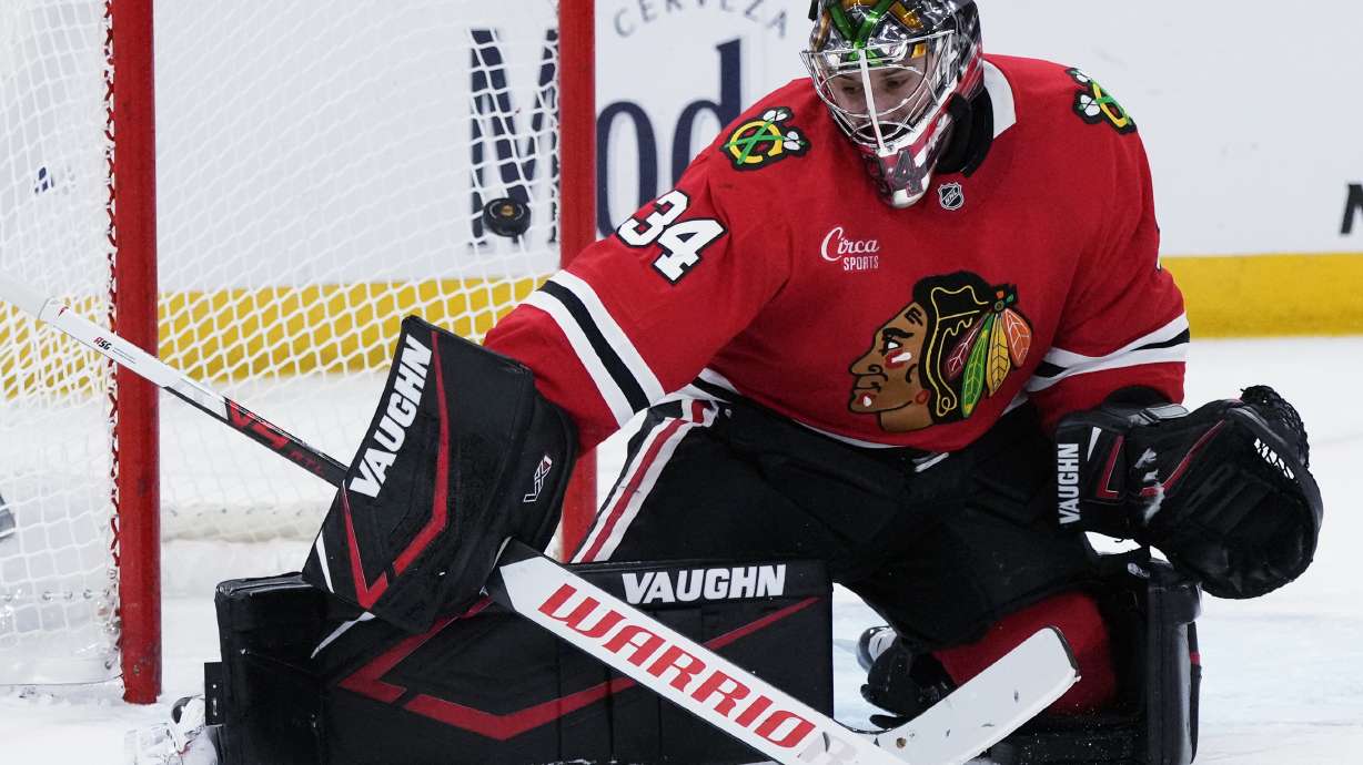 Chicago Blackhawks goaltender Petr Mrazek cannot stop a goal by Columbus Blue Jackets center Sean Monahan during the second period of an NHL hockey game in Chicago, Sunday, Dec.1, 2024.