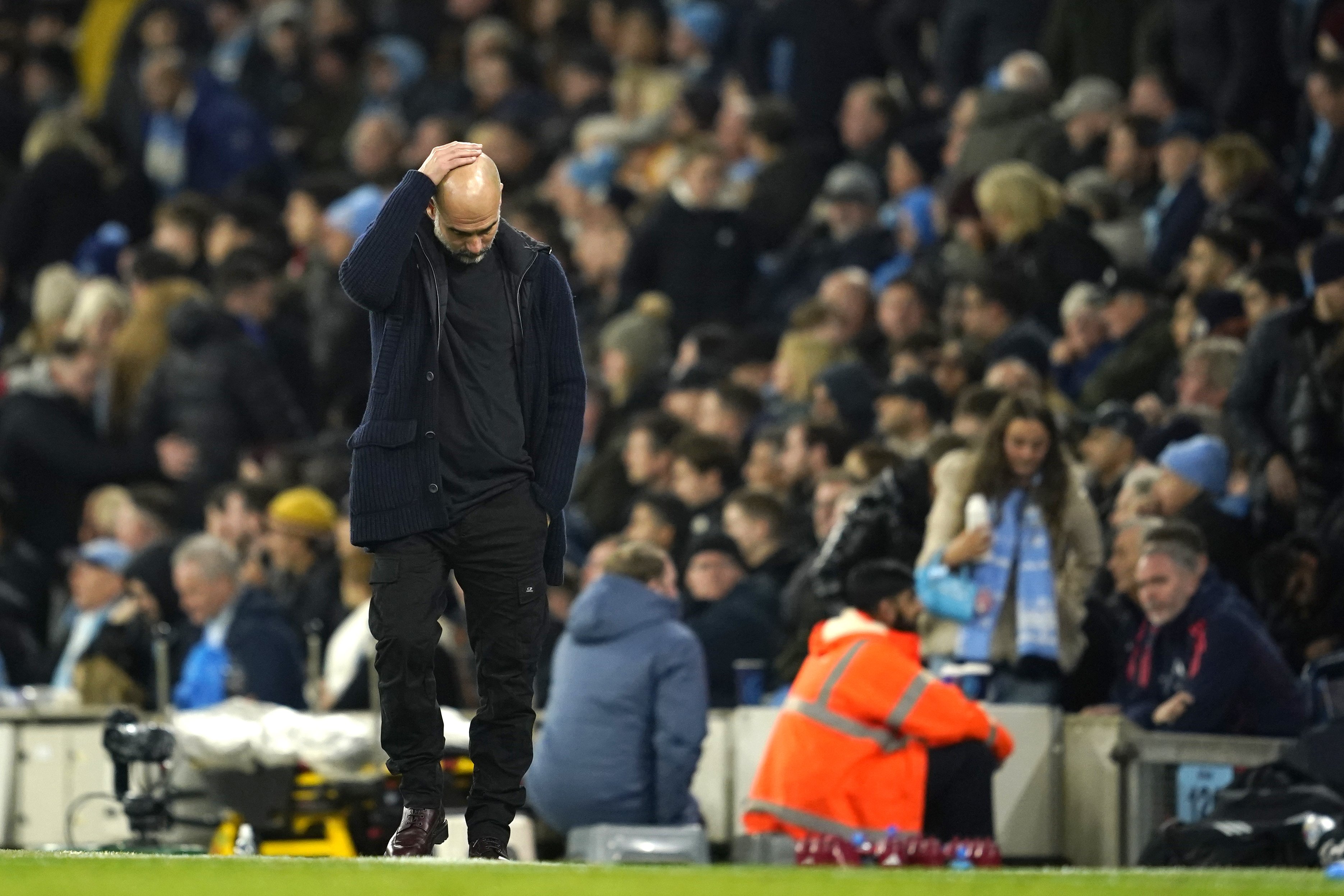 Manchester City's head coach Pep Guardiola reacts during the English Premier League soccer match between Manchester City and Manchester United at the Etihad Stadium in Manchester, Sunday, Dec. 15, 2024.