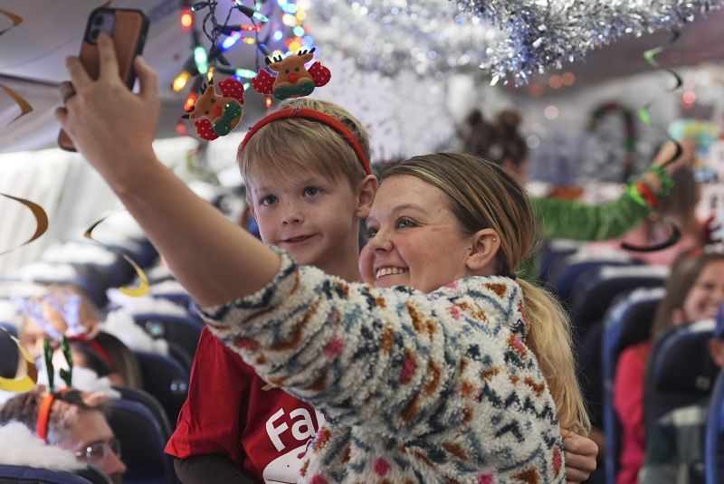 Flight takes kids to visit Santa at North Pole scene in transformed Denver airport hangar