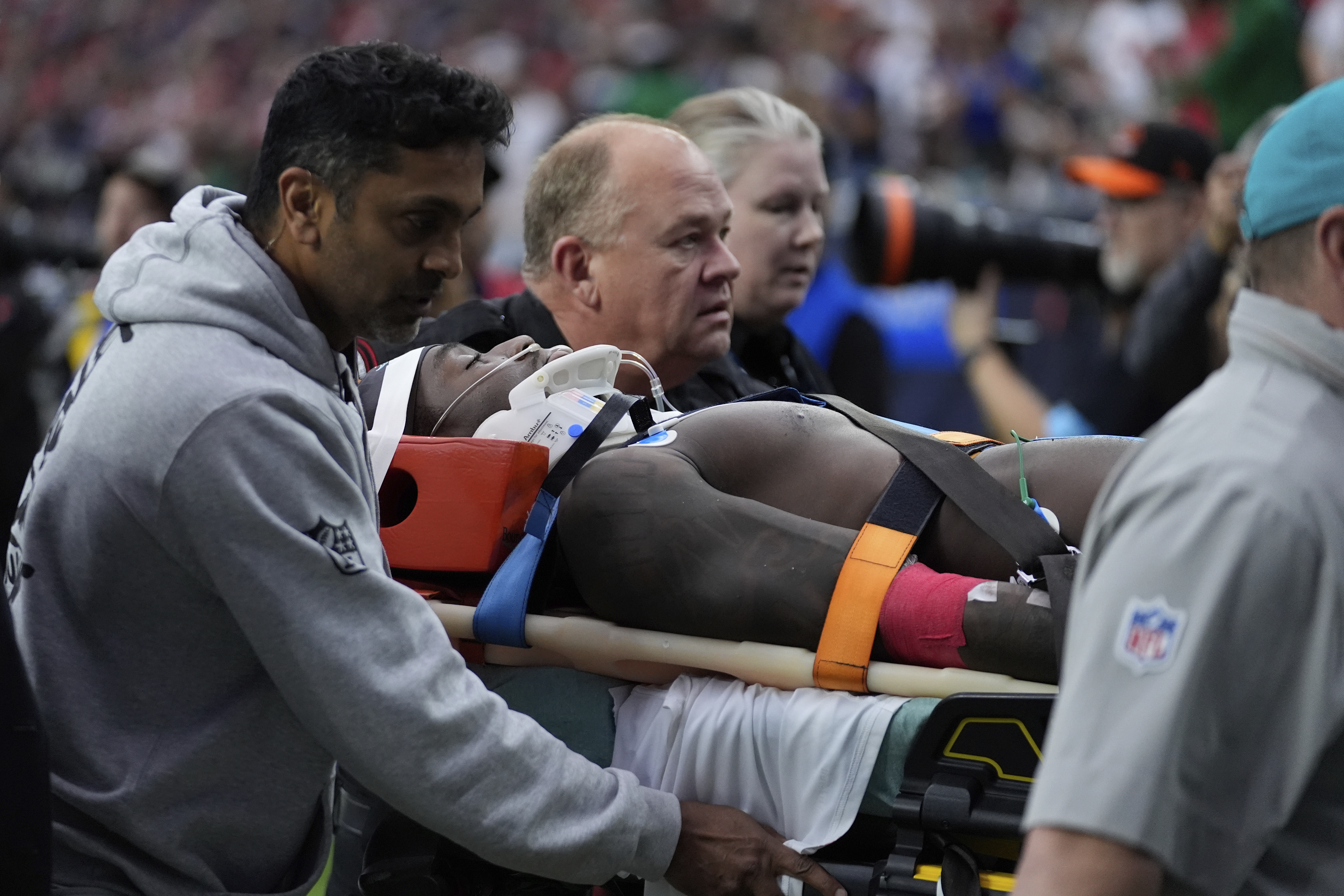 Miami Dolphins wide receiver Grant DuBose (88) is carted off the field after being injured during the second half of an NFL football game against the Houston Texans, Sunday, Dec. 15, 2024, in Houston. 