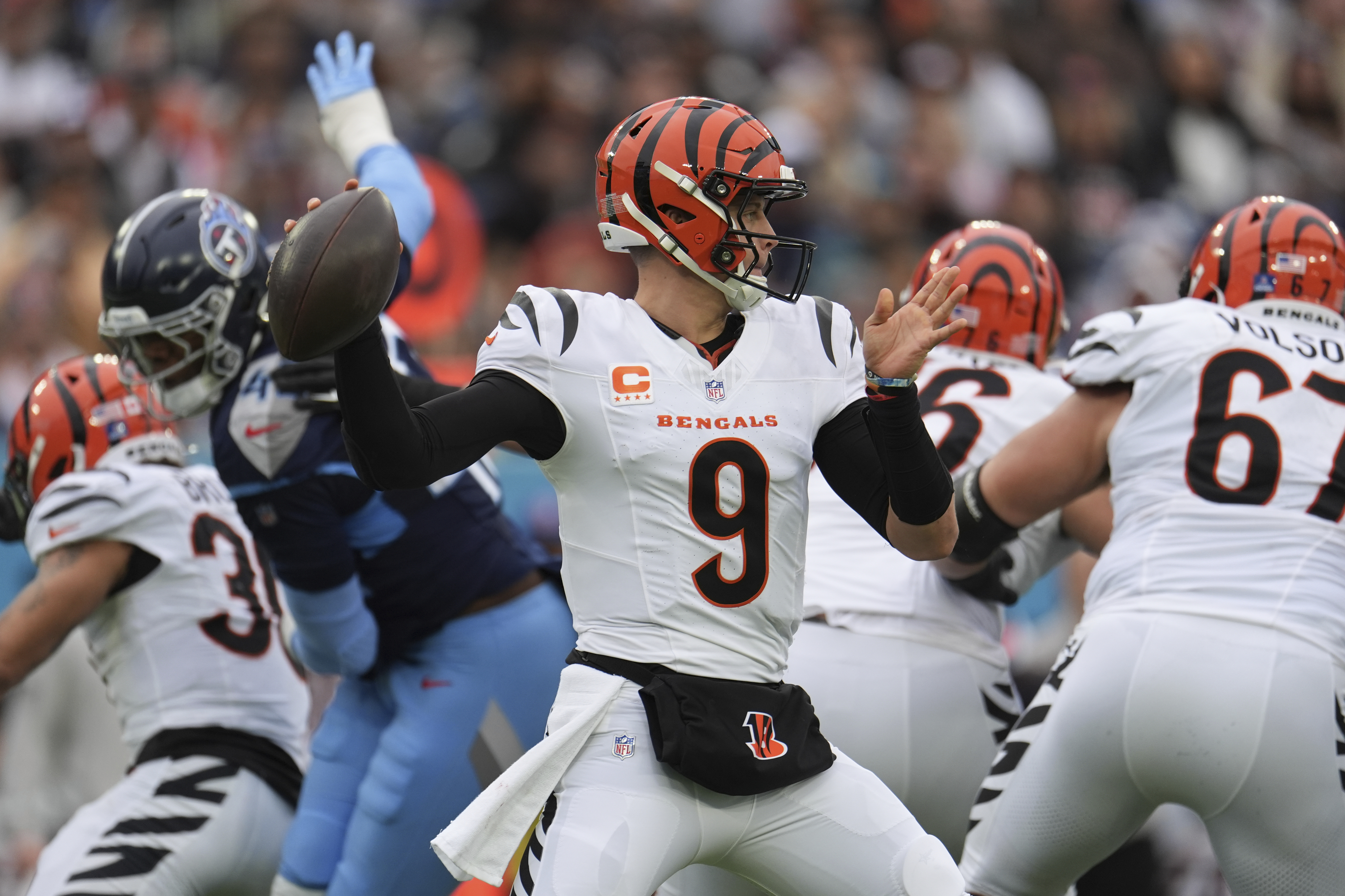 Cincinnati Bengals quarterback Joe Burrow (9) looks to pass during the first half of an NFL football game against the Tennessee Titans, Sunday, Dec. 15, 2024, in Nashville, Tenn. 