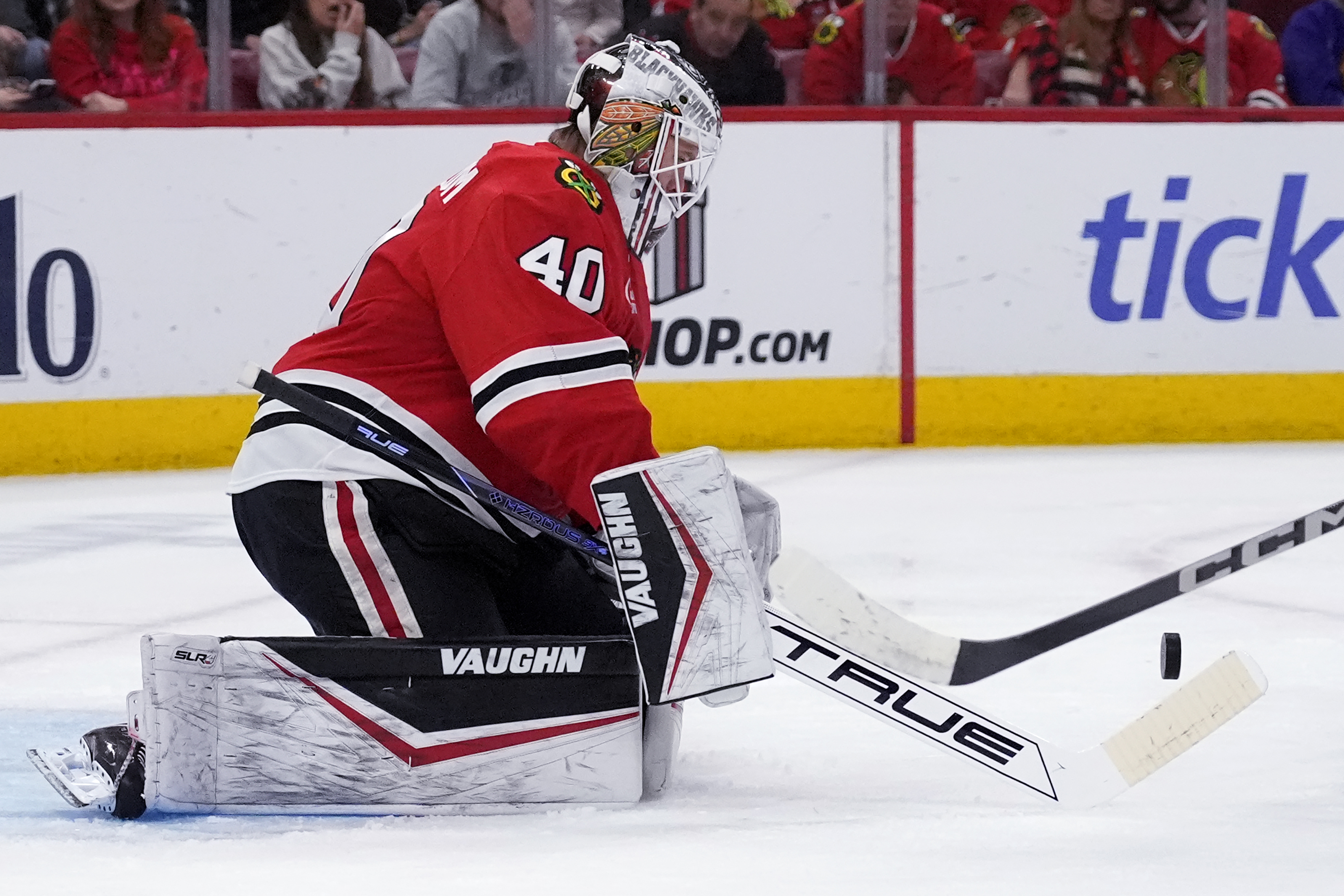 Chicago Blackhawks goaltender Arvid Soderblom stops a shot by New York Islanders left wing Anders Lee during the second period of an NHL hockey game in Chicago, Sunday, Dec. 15, 2024.