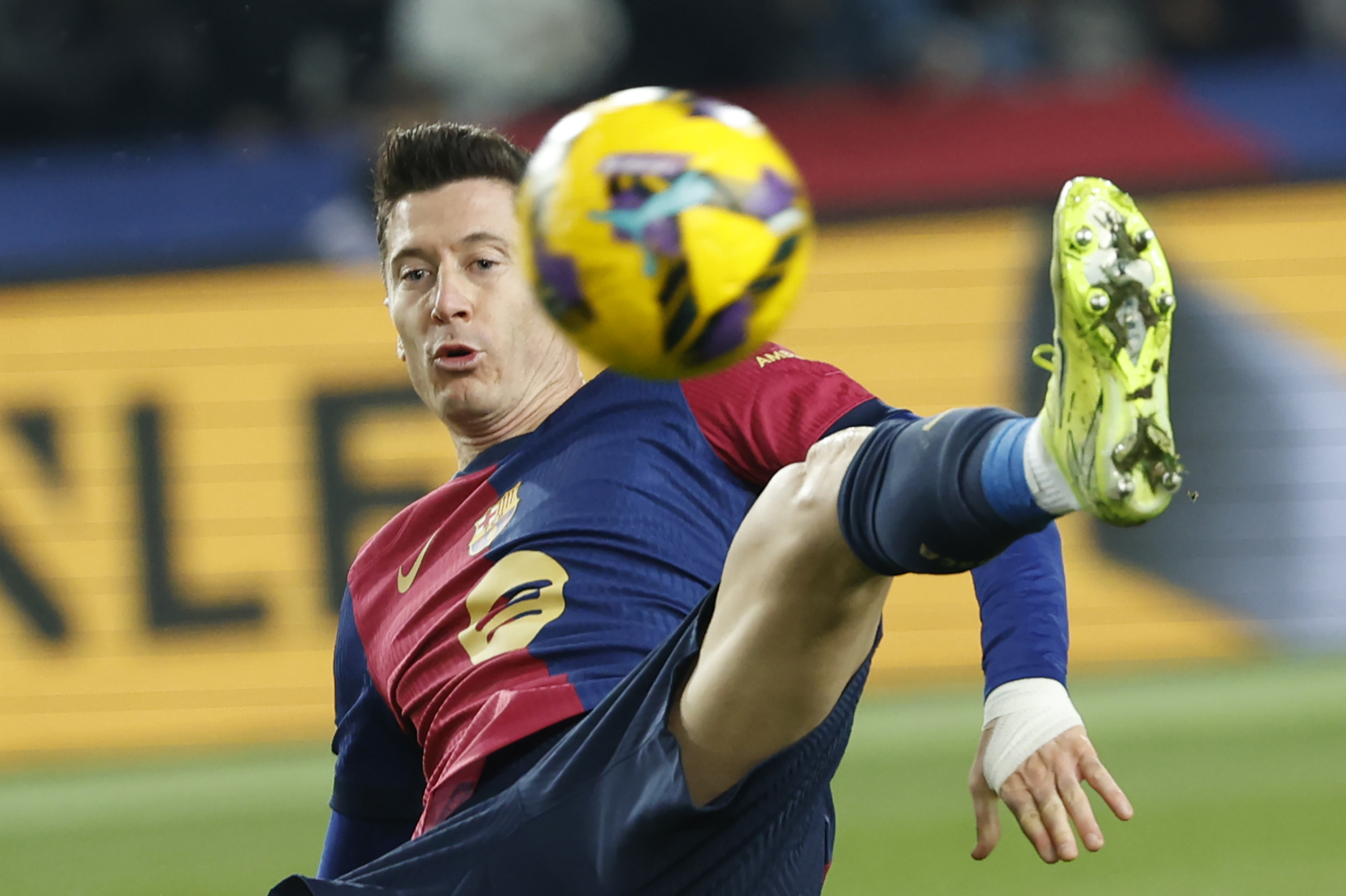 Barcelona's Robert Lewandowski challenges for the ball during the Spanish La Liga soccer match between Barcelona and Leganes at the Lluis Companys Olympic Stadium in Barcelona, Spain, Sunday, Dec. 15, 2024. 