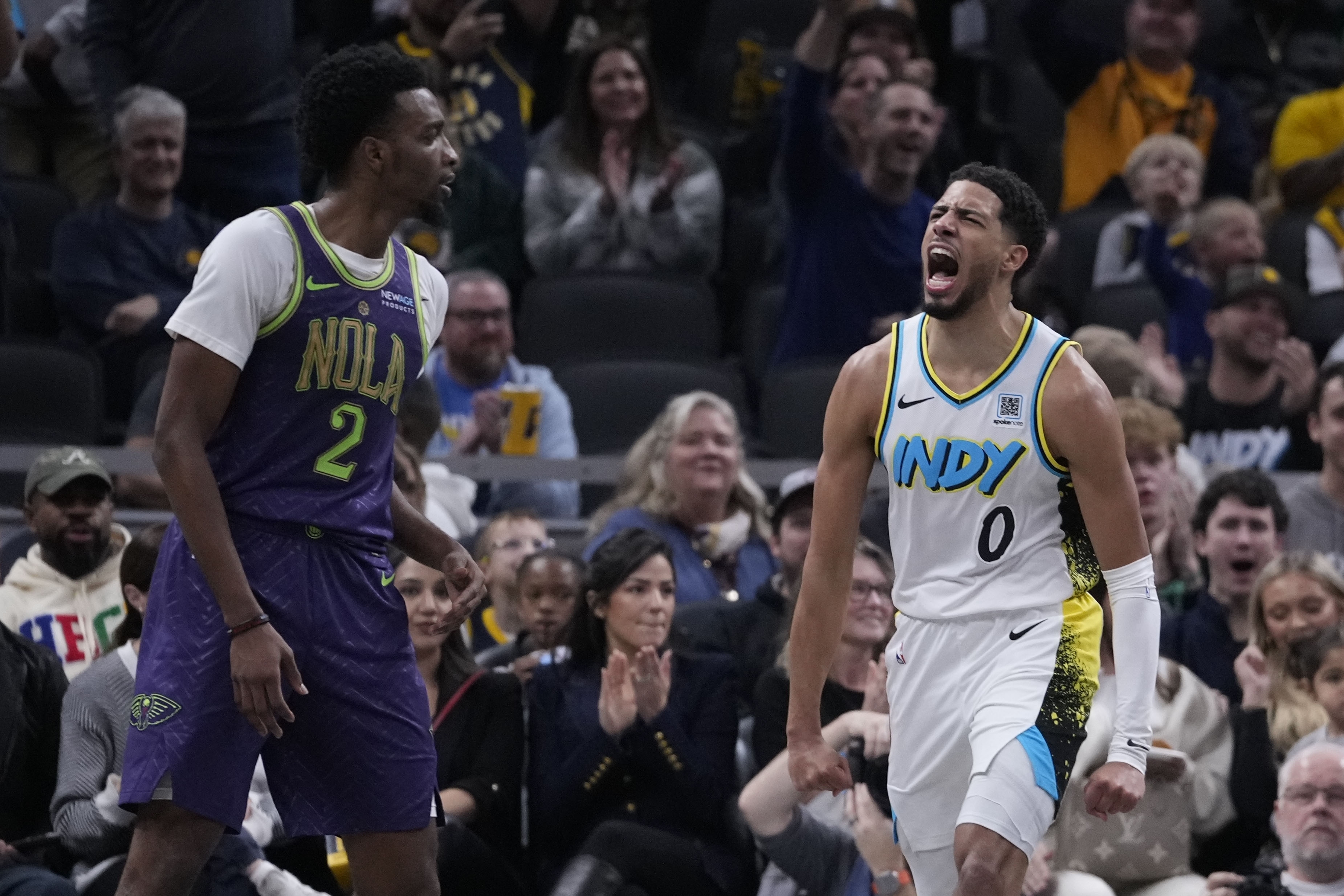 Indiana Pacers' Tyrese Haliburton (0) reacts as New Orleans Pelicans' Herbert Jones (2) walks by during the second half of an NBA basketball game, Sunday, Dec. 15, 2024, in Indianapolis. 