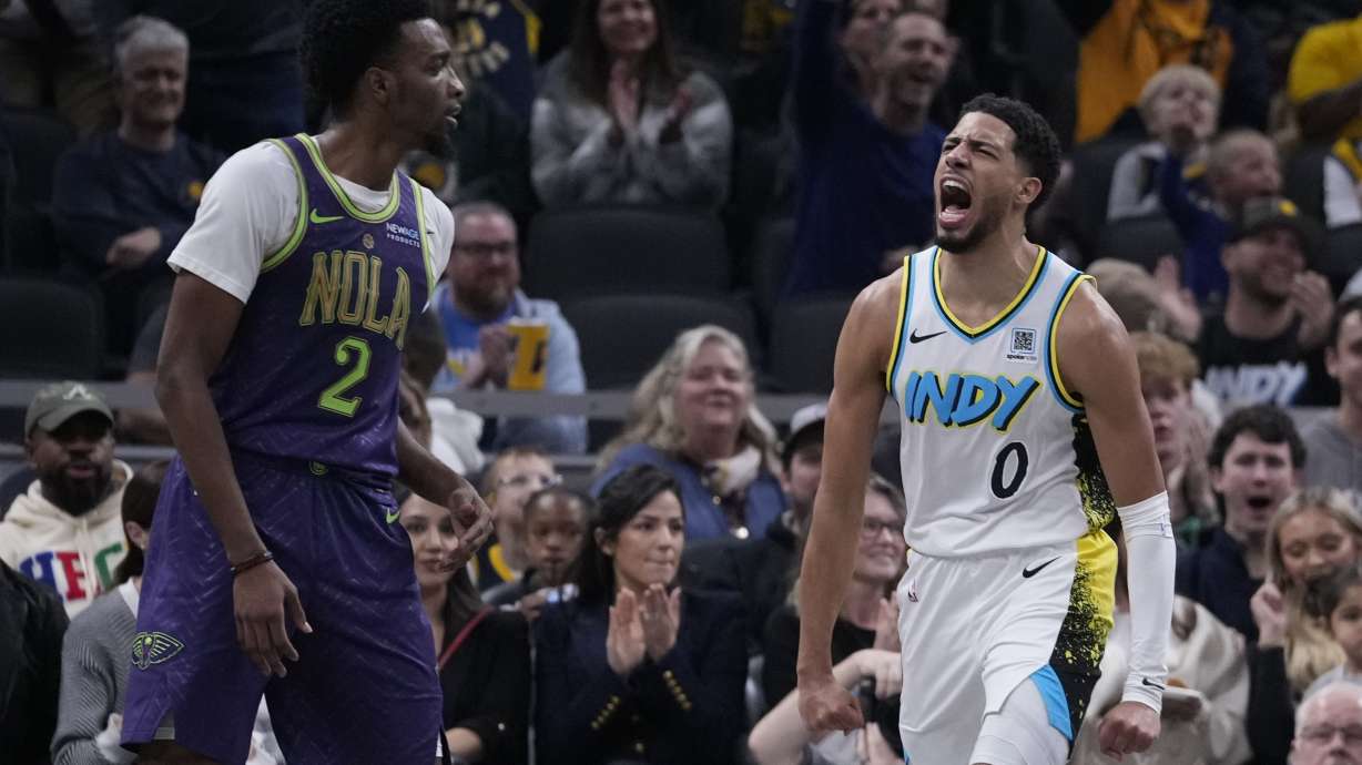 Indiana Pacers' Tyrese Haliburton (0) reacts as New Orleans Pelicans' Herbert Jones (2) walks by during the second half of an NBA basketball game, Sunday, Dec. 15, 2024, in Indianapolis.