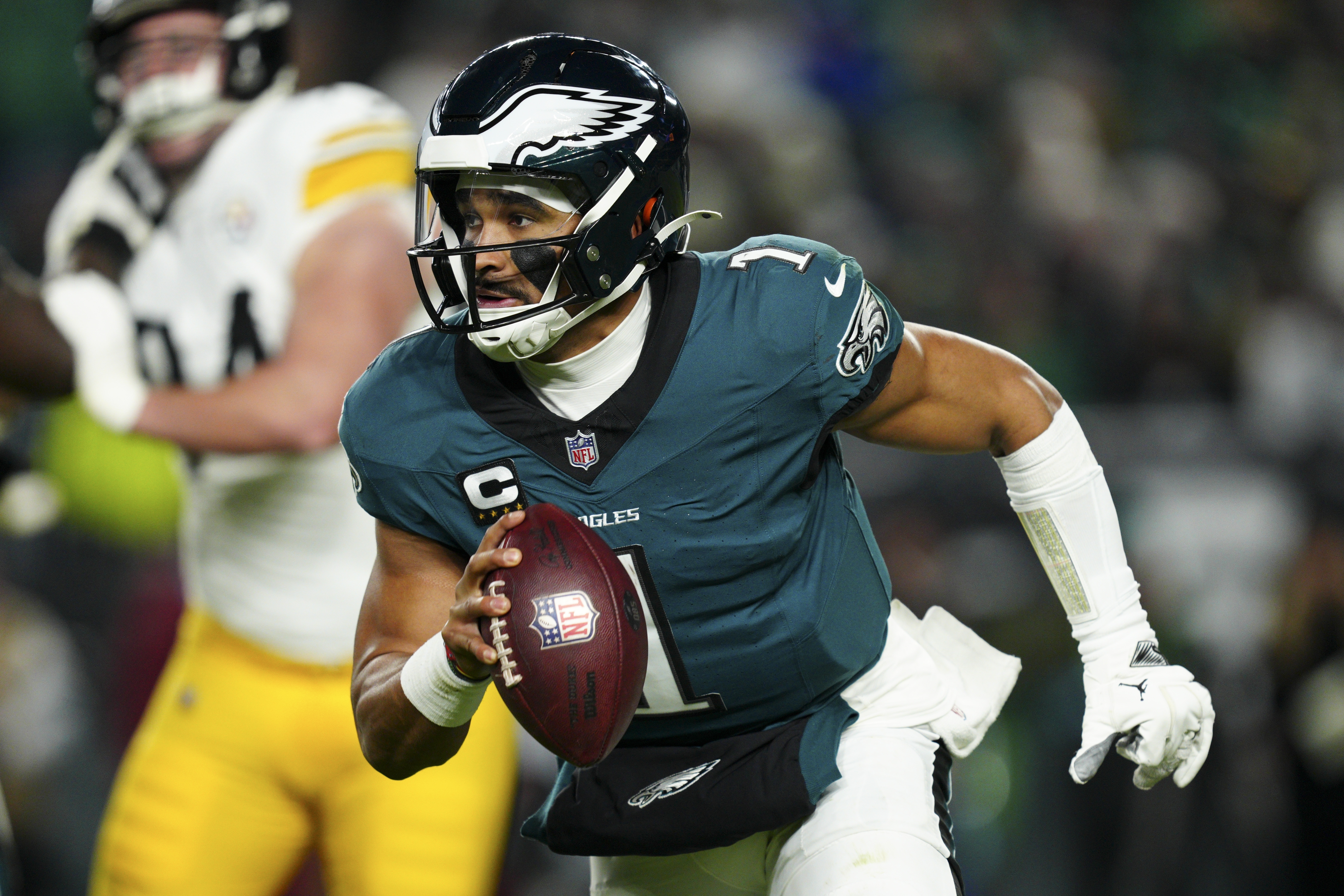 Philadelphia Eagles quarterback Jalen Hurts (1) runs the ball during the second half of an NFL football game against the Pittsburgh Steelers on Sunday, Dec. 15, 2024, in Philadelphia. 