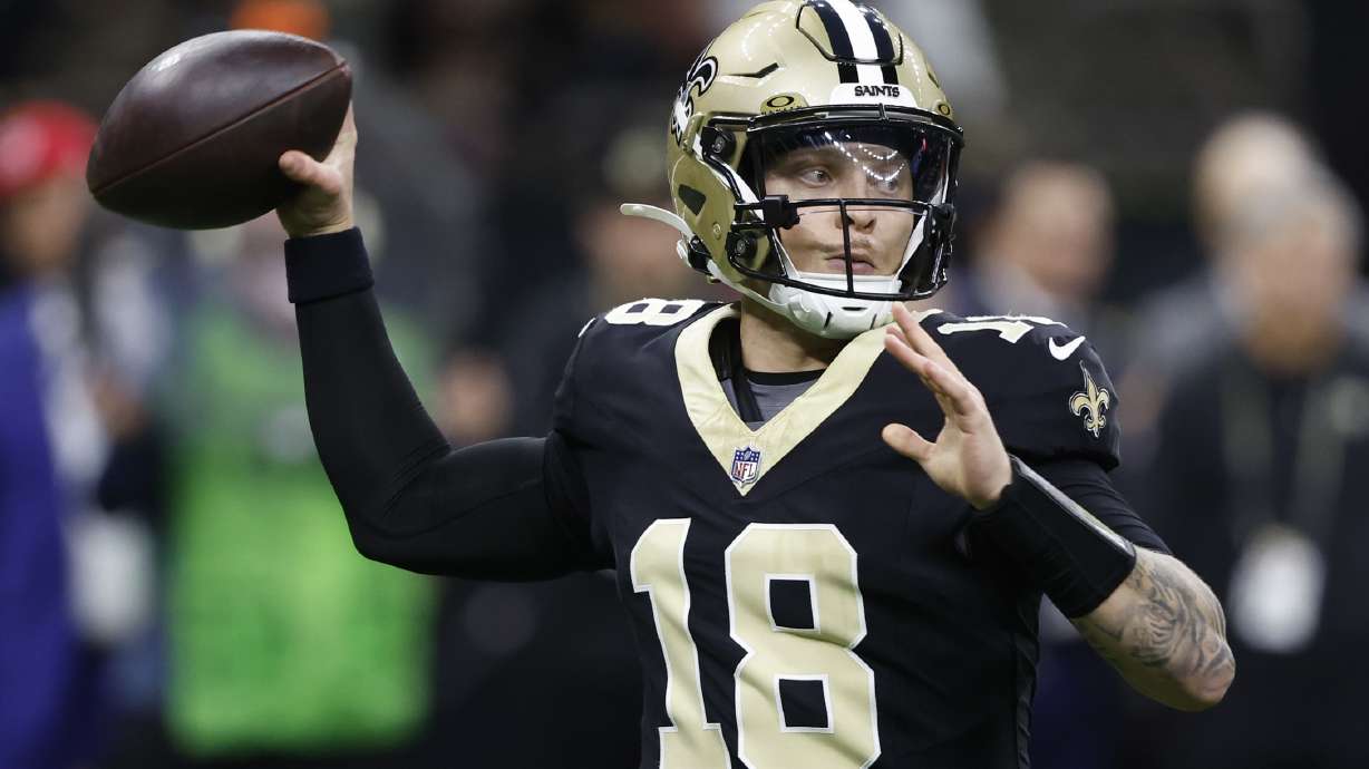 New Orleans Saints quarterback Spencer Rattler (18) throws a pass in the second half of an NFL football game against the Washington Commanders in New Orleans, Sunday, Dec. 15, 2024.