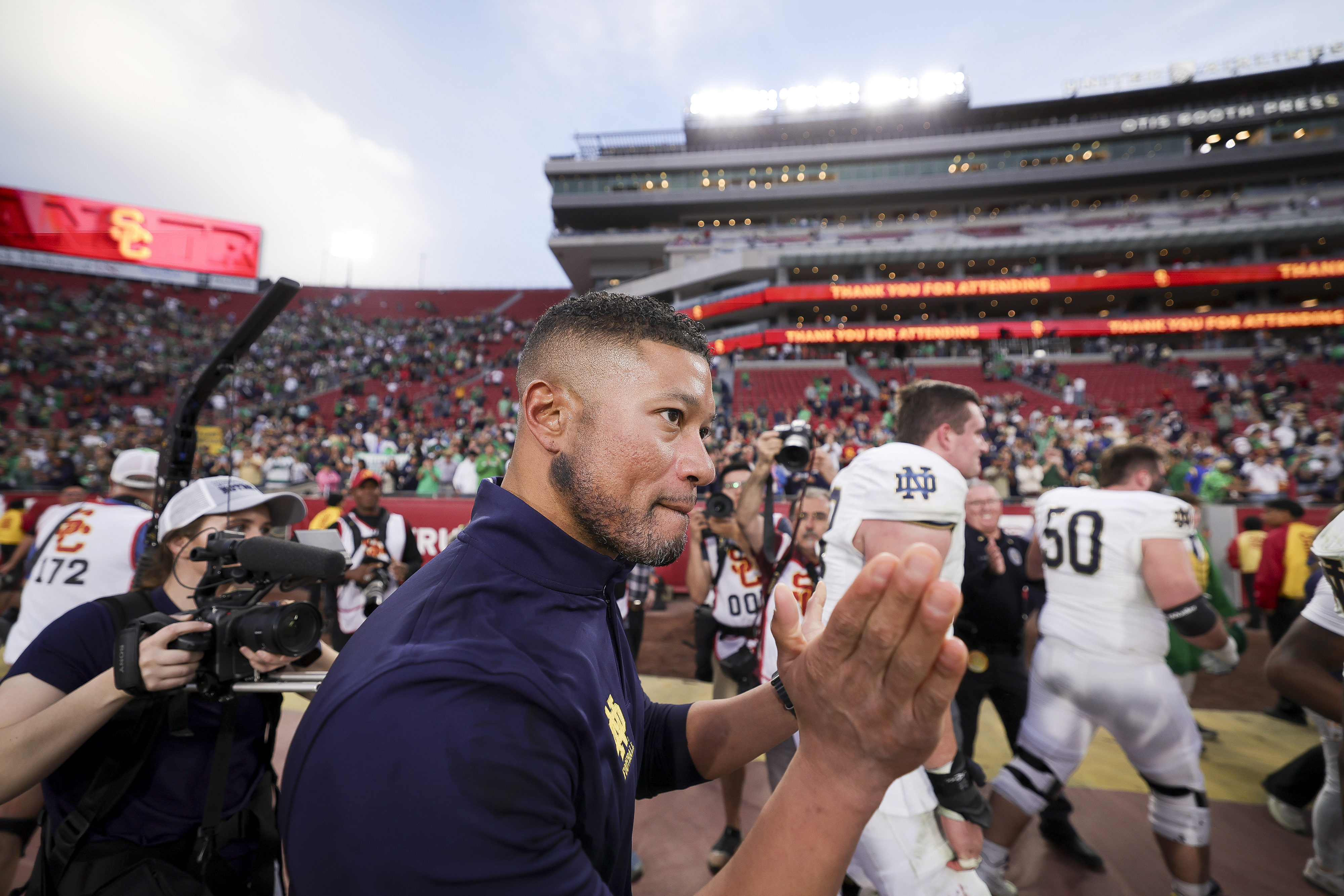 Notre Dame head coach Marcus Freeman walks off the field after the team's win against Southern California in an NCAA college football game Saturday, Nov. 30, 2024, in Los Angeles. 