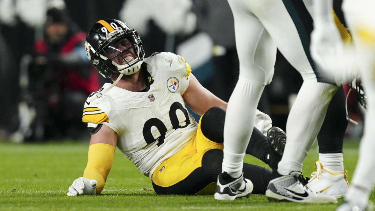 Pittsburgh Steelers linebacker T.J. Watt (90) sits on the field after an injury during the second half of an NFL football game against the Philadelphia Eagles on Sunday, Dec. 15, 2024, in Philadelphia.