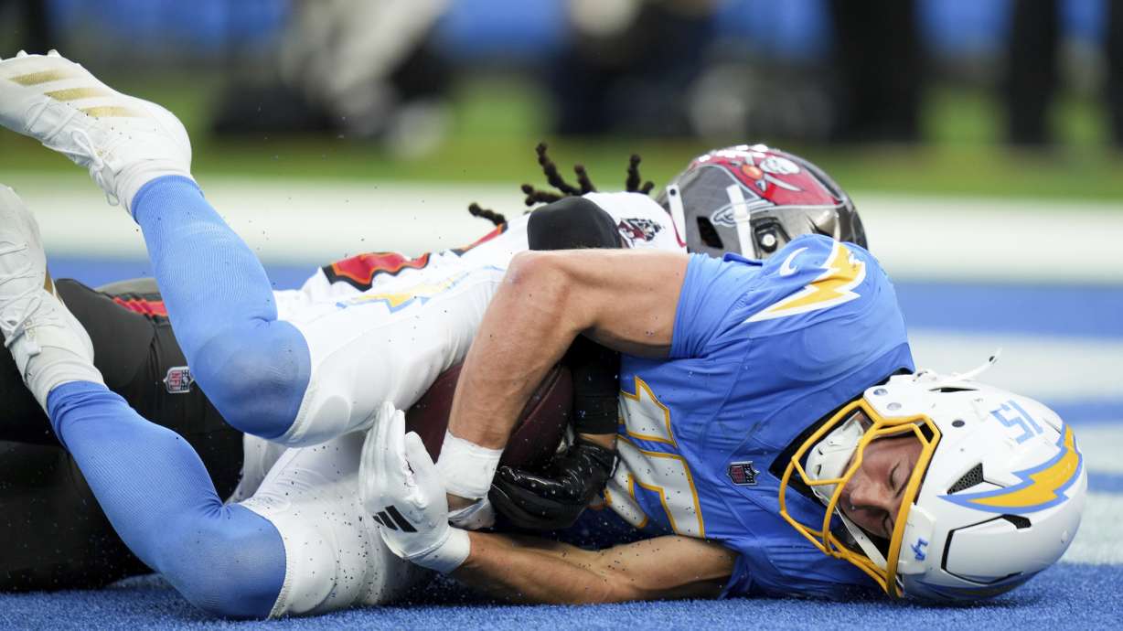 Los Angeles Chargers wide receiver Ladd McConkey (15) makes a touchdown catch during the first half of an NFL football game against the Tampa Bay Buccaneers Sunday, Dec. 15, 2024, in Inglewood, Calif.