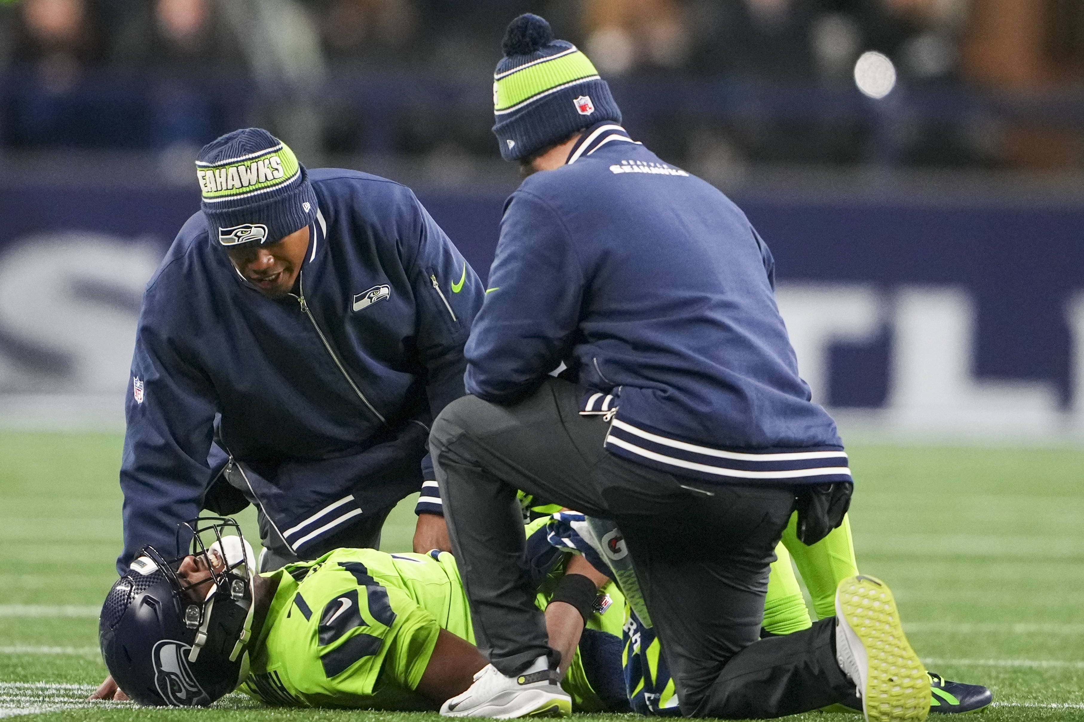 Seattle Seahawks' Geno Smith is hurt during the second half of an NFL football game against the Green Bay Packers Sunday, Dec. 15, 2024, in Seattle. 