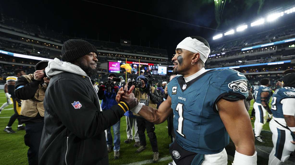 Philadelphia Eagles quarterback Jalen Hurts greets Pittsburgh Steelers head coach Mike Tomlin after an NFL football game Sunday, Dec. 15, 2024, in Philadelphia.