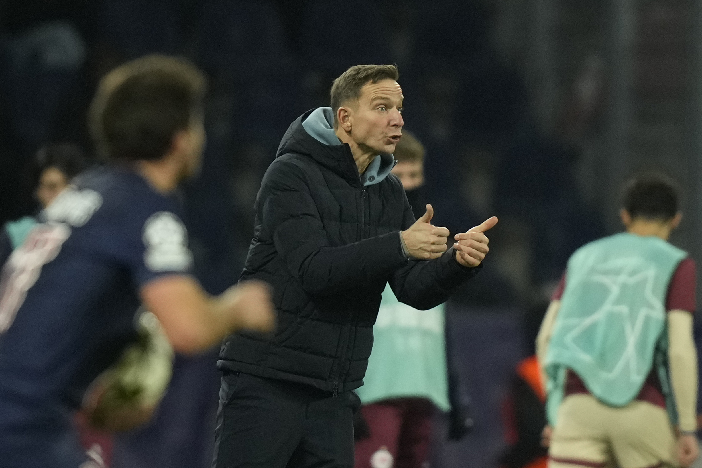 Salzburg's coach Pepijn Lijnders gives instructions to his players during a Champions League opening phase soccer match against PSG in Salzburg, Austria, Tuesday, Dec. 10, 2024.
