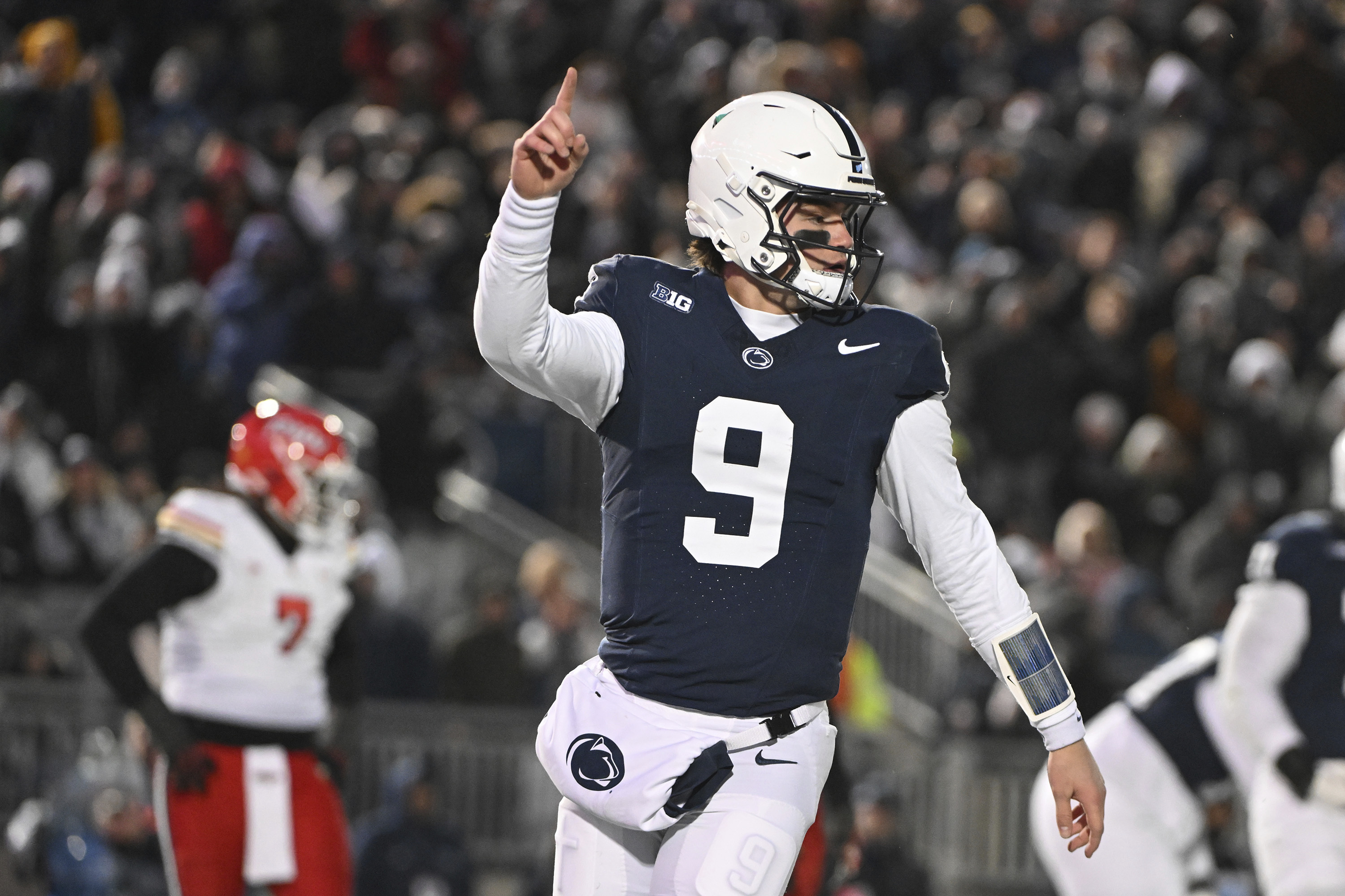 Penn State quarterback Beau Pribula (9) celebrates a touchdown against Maryland during the second quarter of an NCAA college football game, Saturday, Nov. 30, 2024, in State College, Pa. 