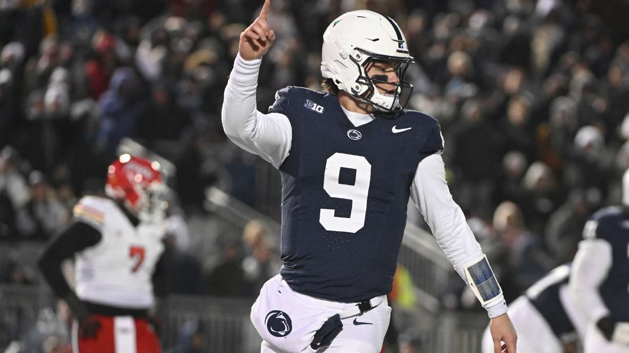 Penn State quarterback Beau Pribula (9) celebrates a touchdown against Maryland during the second quarter of an NCAA college football game, Saturday, Nov. 30, 2024, in State College, Pa.