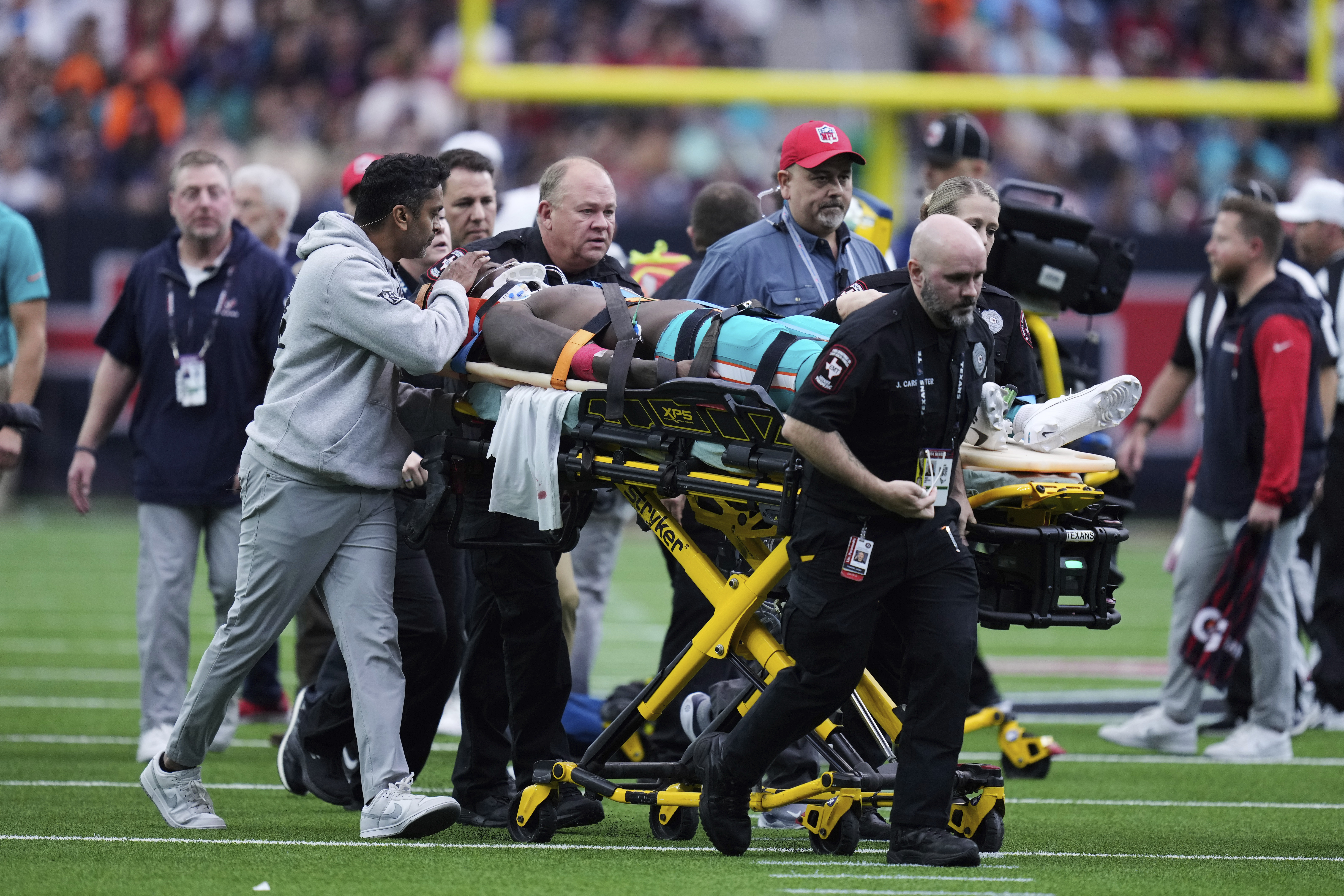 Miami Dolphins wide receiver Grant DuBose (88) is carted off the field after being injured during the second half of an NFL football game against the Houston Texans, Sunday, Dec. 15, 2024, in Houston. 