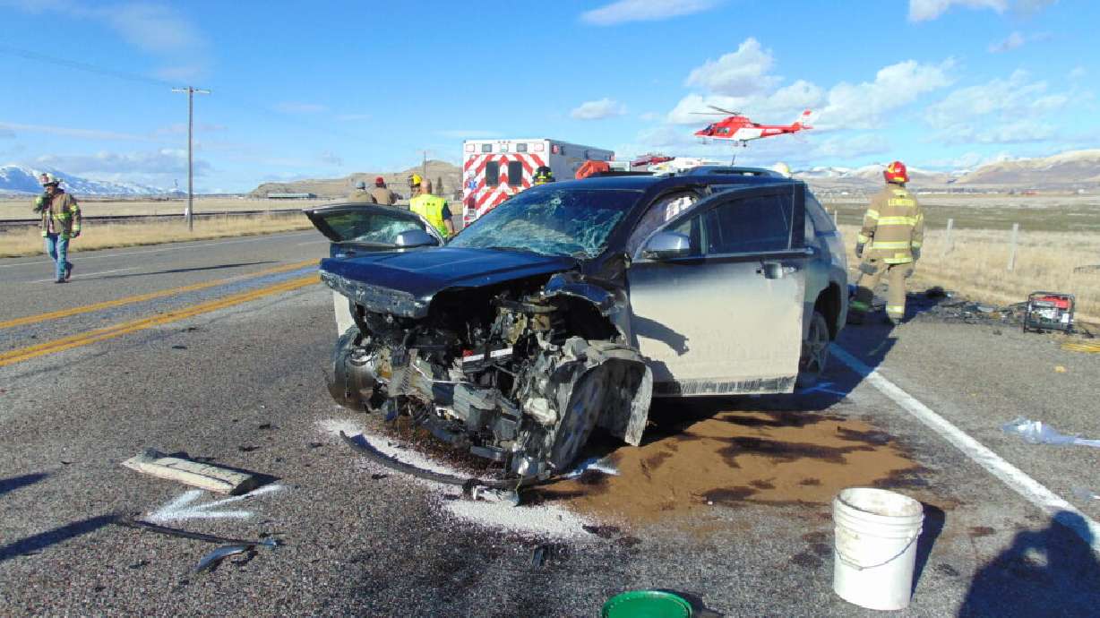 Emergency responders at the scene of a fatal crash on U.S. 91 near Lewiston in Cache County on Sunday.