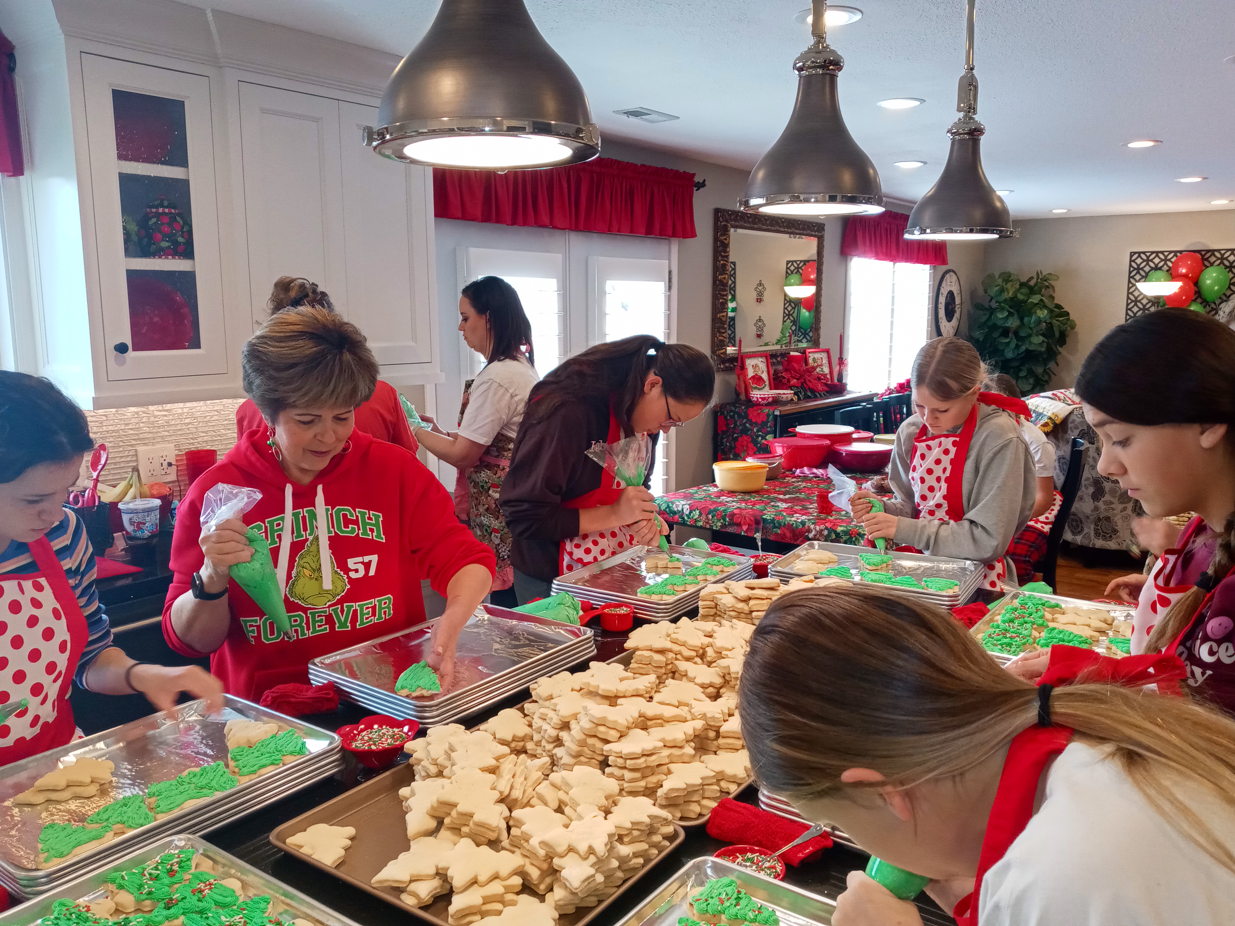 Kerri and her “helpers” bake and decorate over 1,200 Christmas cookies.