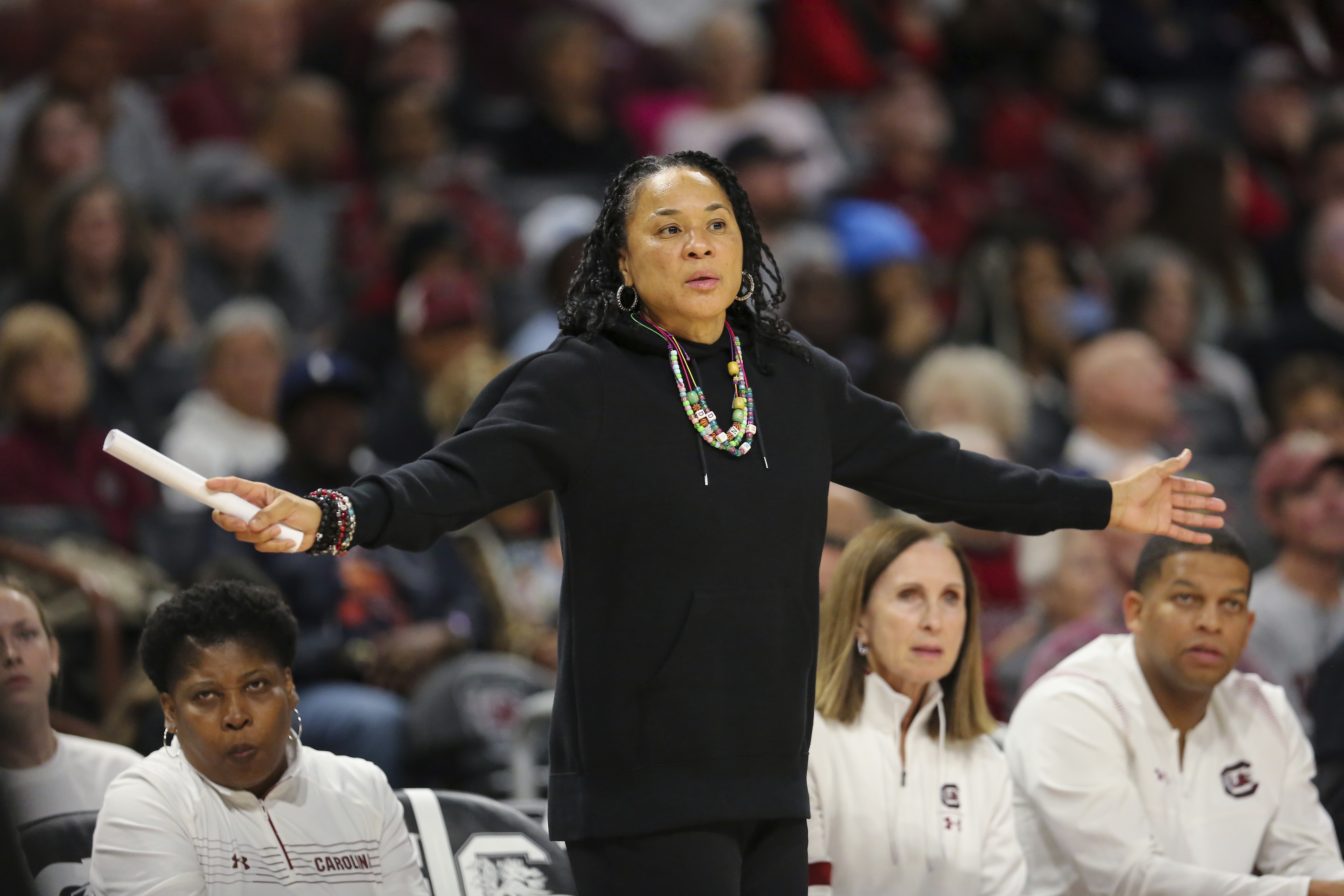 South Carolina head coach Dawn Staley her arms out for her defense to see during the second half of an NCAA college basketball game against South Florida Sunday, Dec. 15, 2024, in Columbia, S.C. 