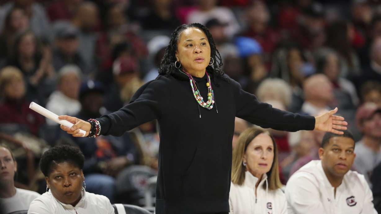 South Carolina head coach Dawn Staley her arms out for her defense to see during the second half of an NCAA college basketball game against South Florida Sunday, Dec. 15, 2024, in Columbia, S.C.
