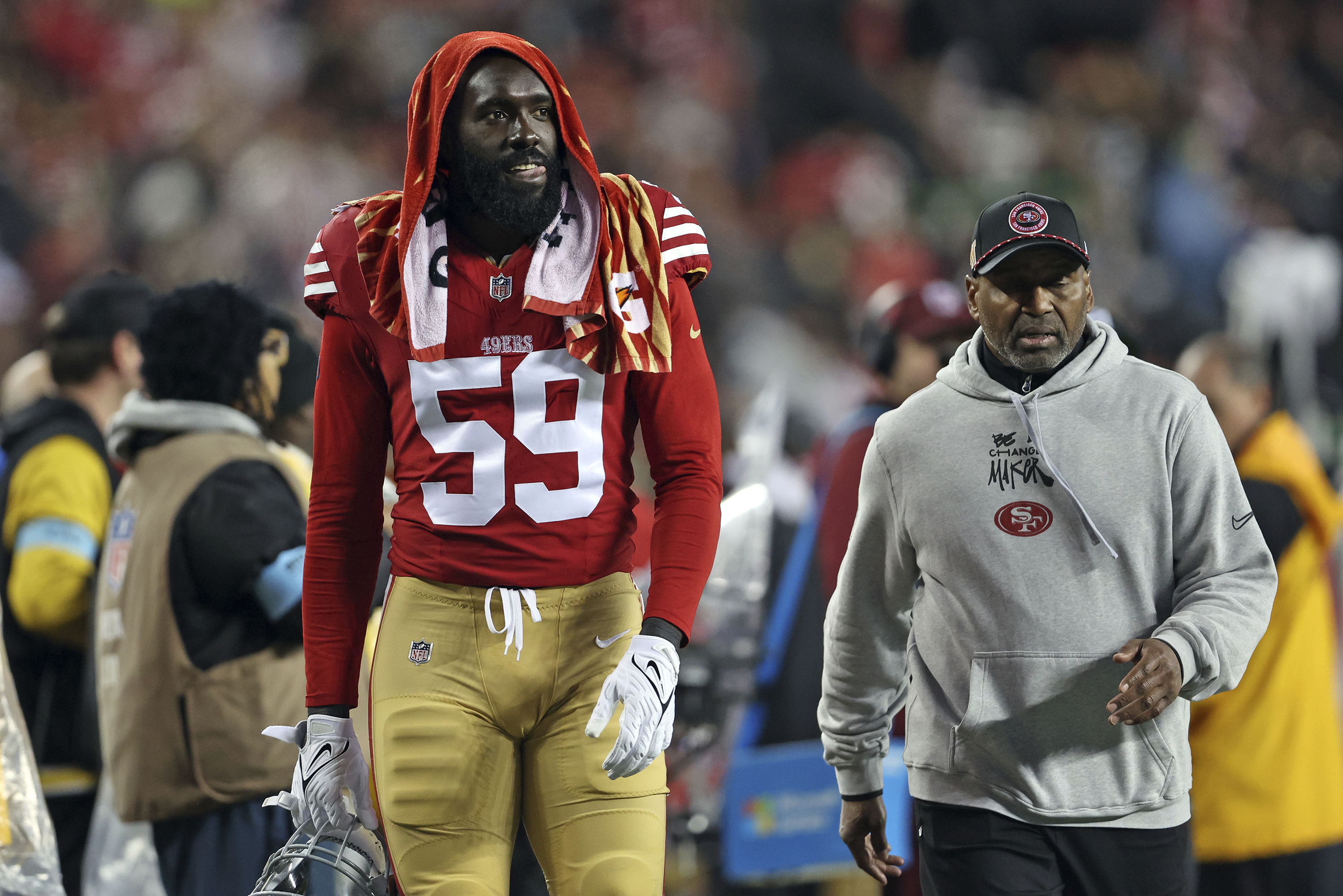 San Francisco 49ers' De'Vondre Campbell walks to the locker room during the second half of an NFL football game against the Los Angeles Rams in Santa Clara, Calif., Thursday, Dec. 12, 2024. 