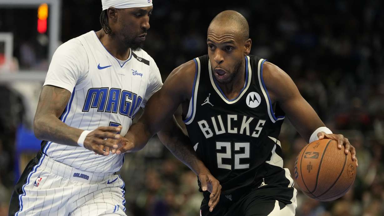 Milwaukee Bucks' Khris Middleton tries to get past Orlando Magic's Kentavious Caldwell-Pope during the second half of an Emirates NBA cup tournament quarterfinals basketball game Tuesday, Dec. 10, 2024, in Milwaukee.