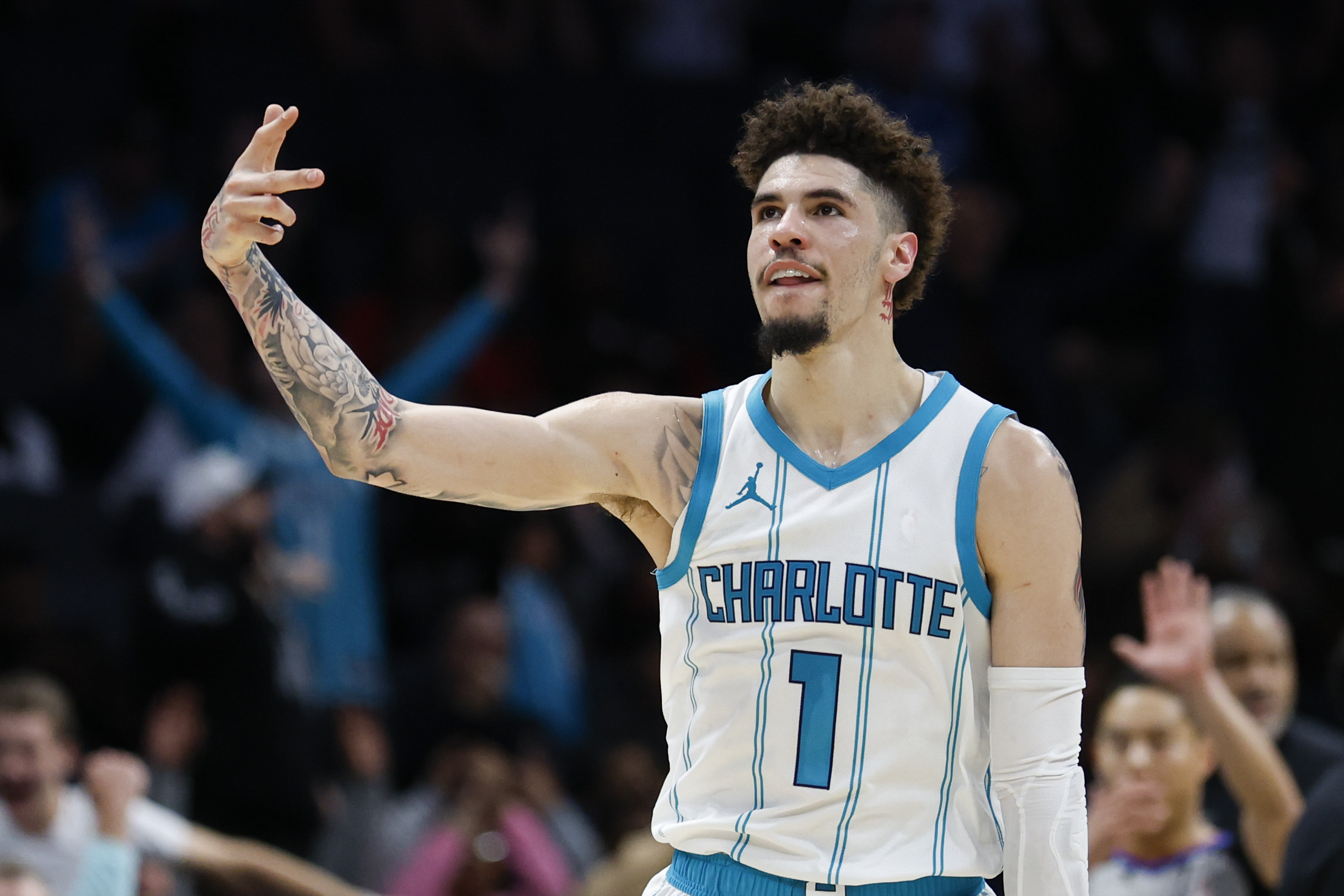 Charlotte Hornets guard LaMelo Ball reacts after making a three point basket against the Miami Heat during the second half of an NBA basketball game in Charlotte, N.C., Wednesday, Nov. 27, 2024. 
