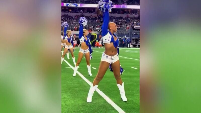 Armani Latimer on the field of AT&T Stadium performing for the first time without her wig with the Dallas Cowboys Cheerleaders.