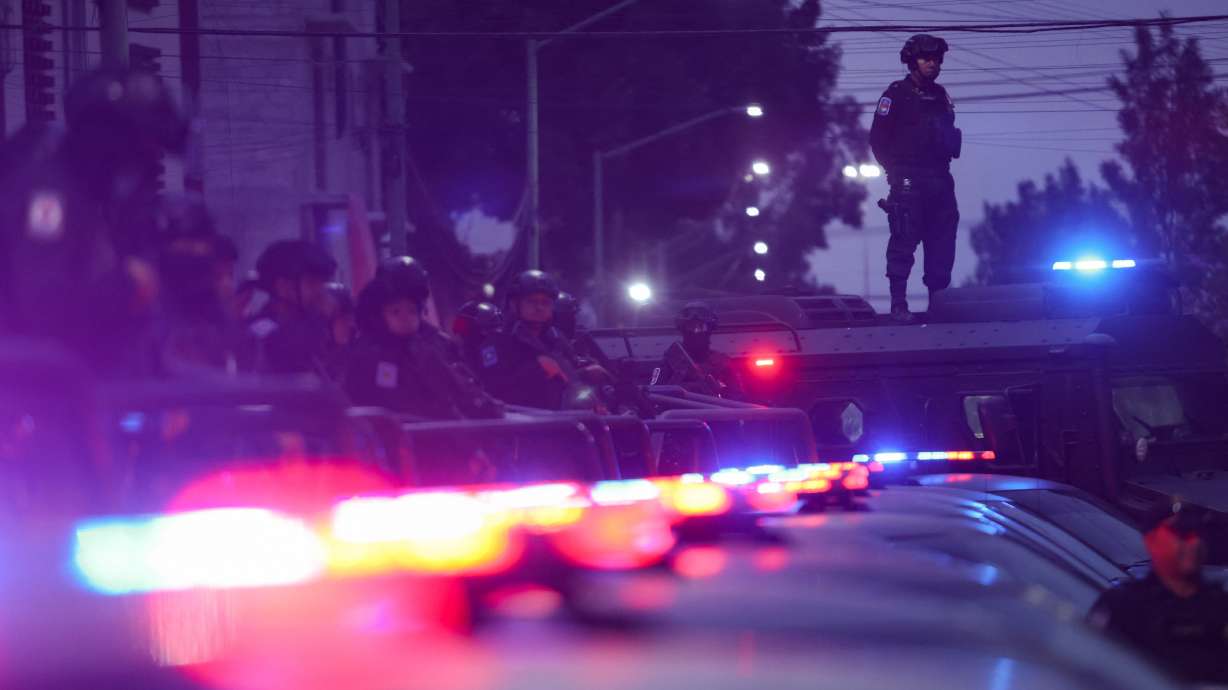 Police officers stand guard as they participate in a security operation to control the violence on the streets, in the Tepito neighborhood in Mexico City, Mexico, Nov. 1.