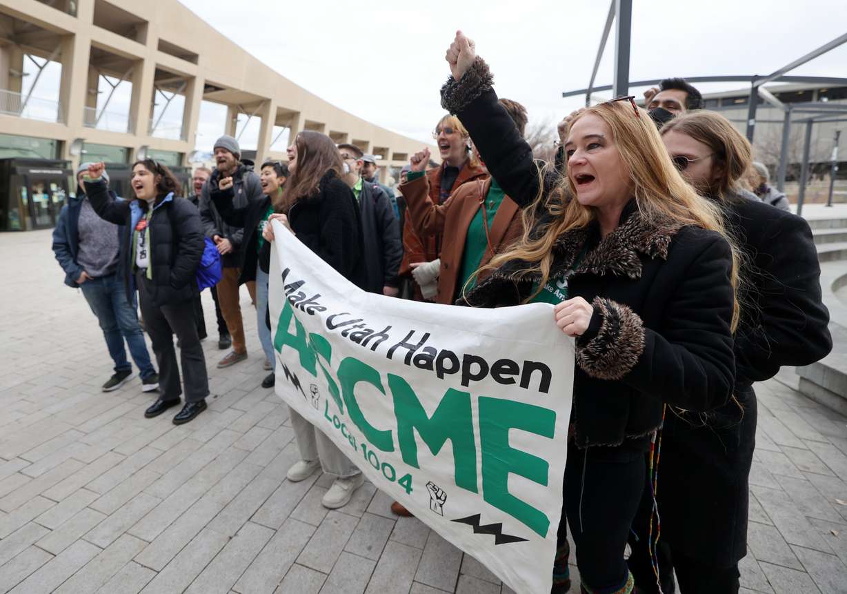 Anna Young, Salt Lake City Public Library passport agent and library assistant, chants with other Salt Lake City Public Library Workers United members and supporters ahead of a Salt Lake City Public Library Board of Directors vote on a resolution allowing library workers to unionize outside of The Salt Lake Main Library in Salt Lake City on Monday. The resolution passed.