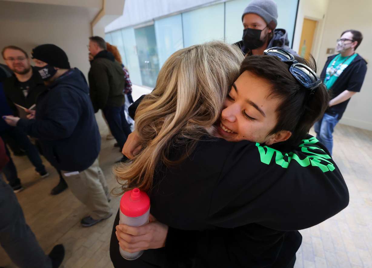 Katy Hagge, union organizer, and Esther Daranciang, Salt Lake City Public Library children’s librarian, embrace after the Salt Lake City Public Library Board of Directors voted to pass a resolution allowing library workers to unionize, at the Salt Lake Main Library in Salt Lake City on Monday.