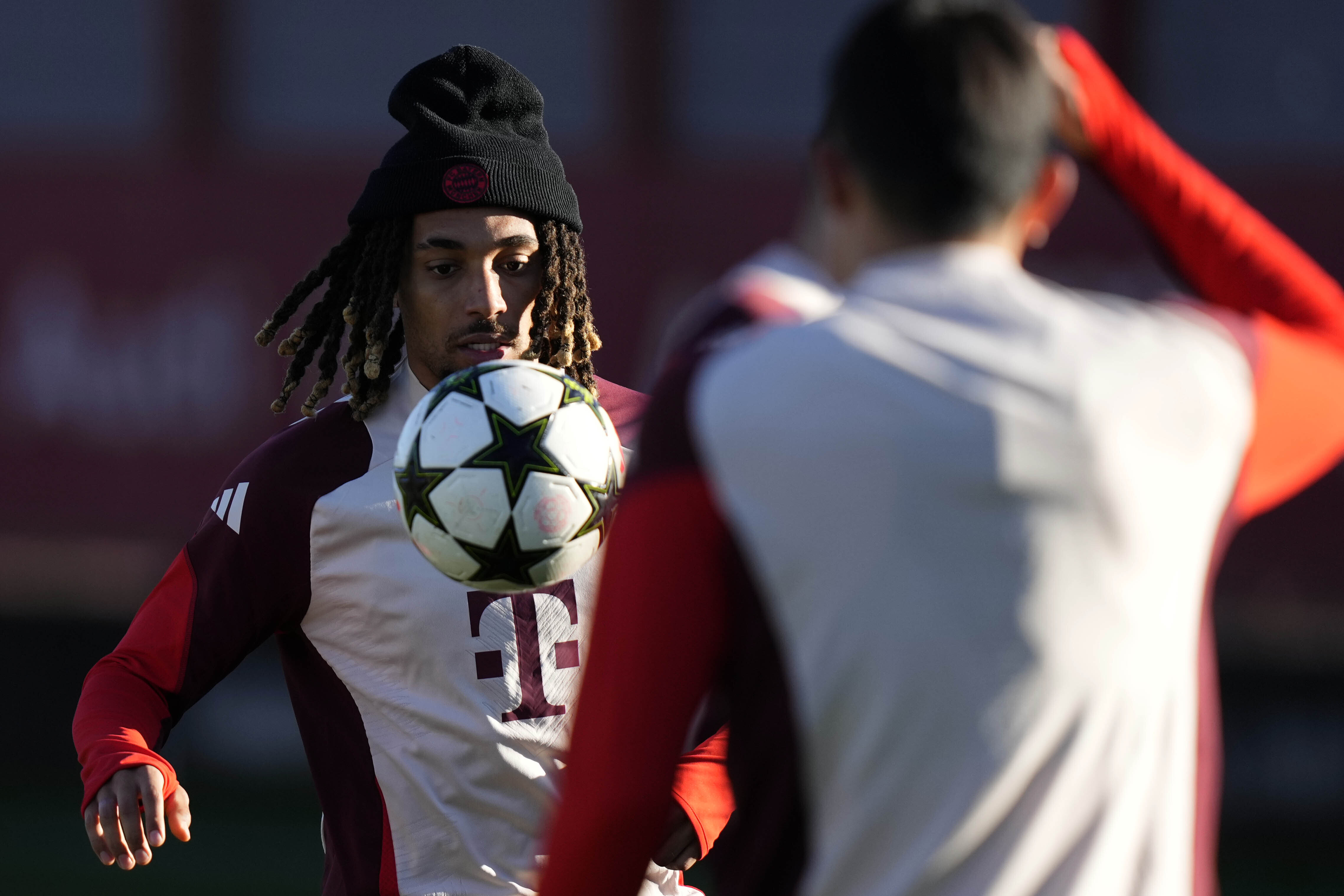 Bayern's Sacha Boey controls a ball during a training session in Munich, Germany, Monday, Nov. 25, 2024, ahead of the Champions League opening phase soccer match between FC Bayern and PSG. 