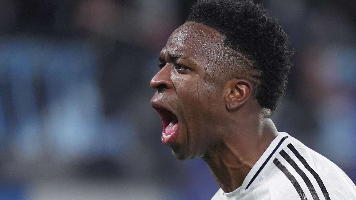 Real Madrid's Vinicius Junior celebrate after scoring during a Champions League opening phase soccer match between Atalanta and Real Madrid at the Bergamo's stadium, in Bergamo, Italy, Tuesday, Dec. 10, 2024.
